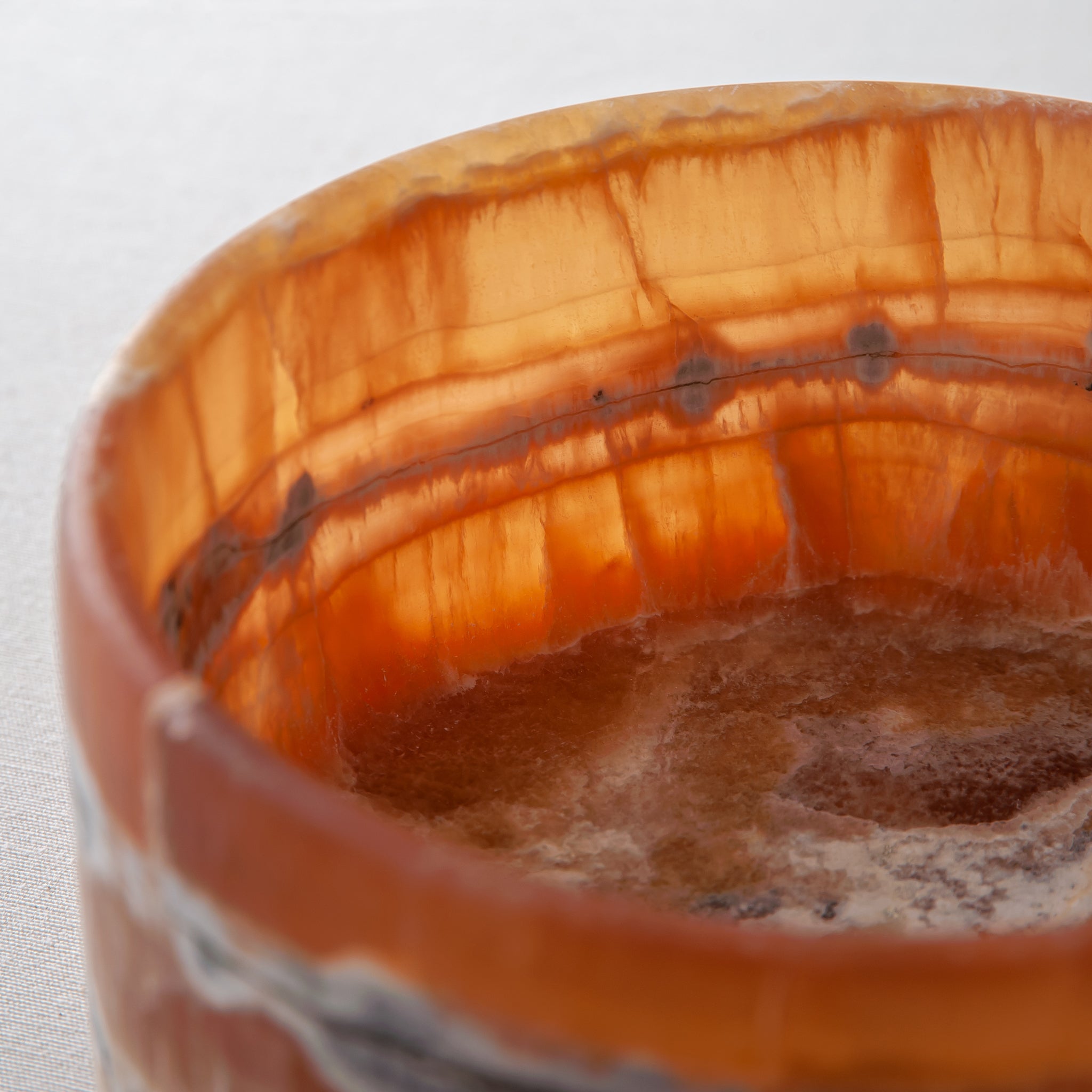 handcrafted onyx bowl with warm amber tones and natural veining for luxury table decor
