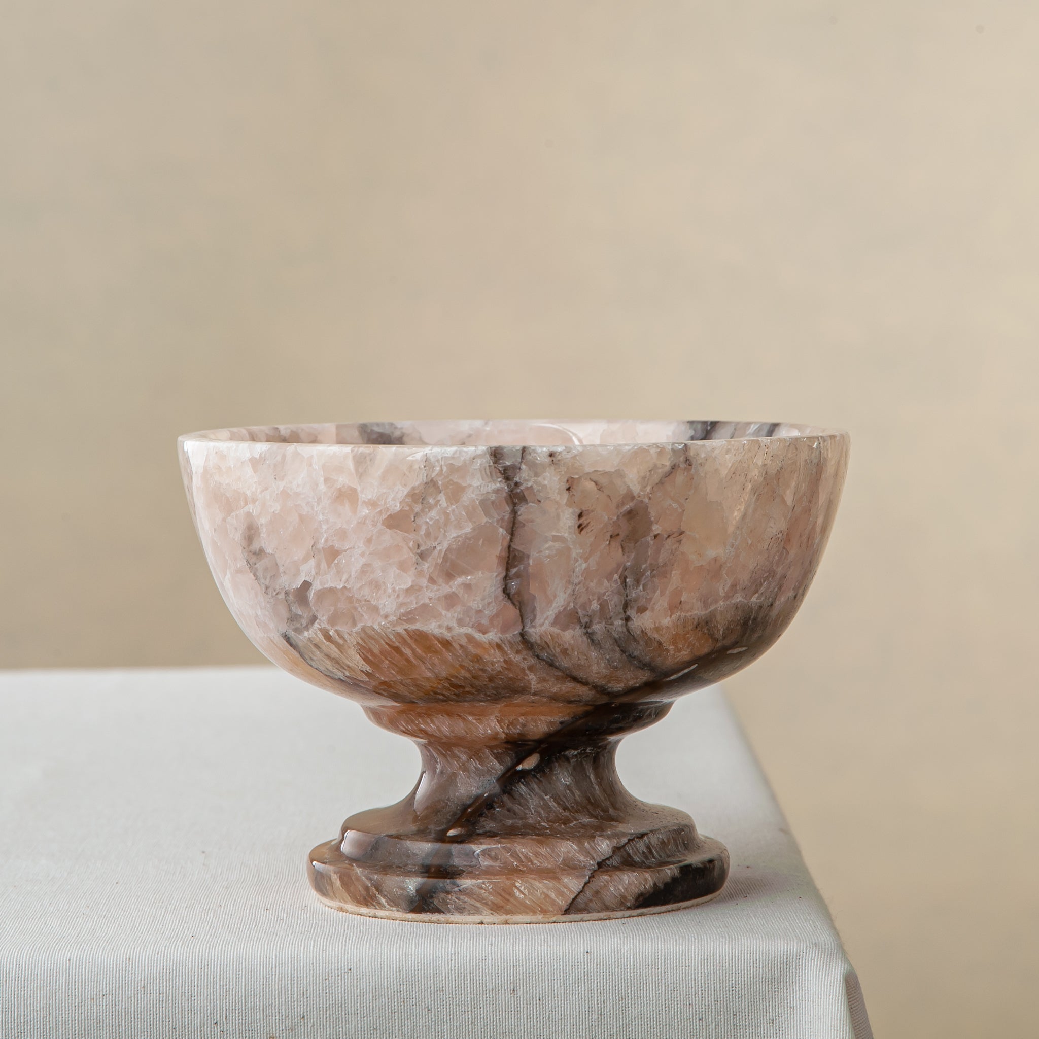 natural stone onyx bowl with warm hues and organic veining for modern interior styling
