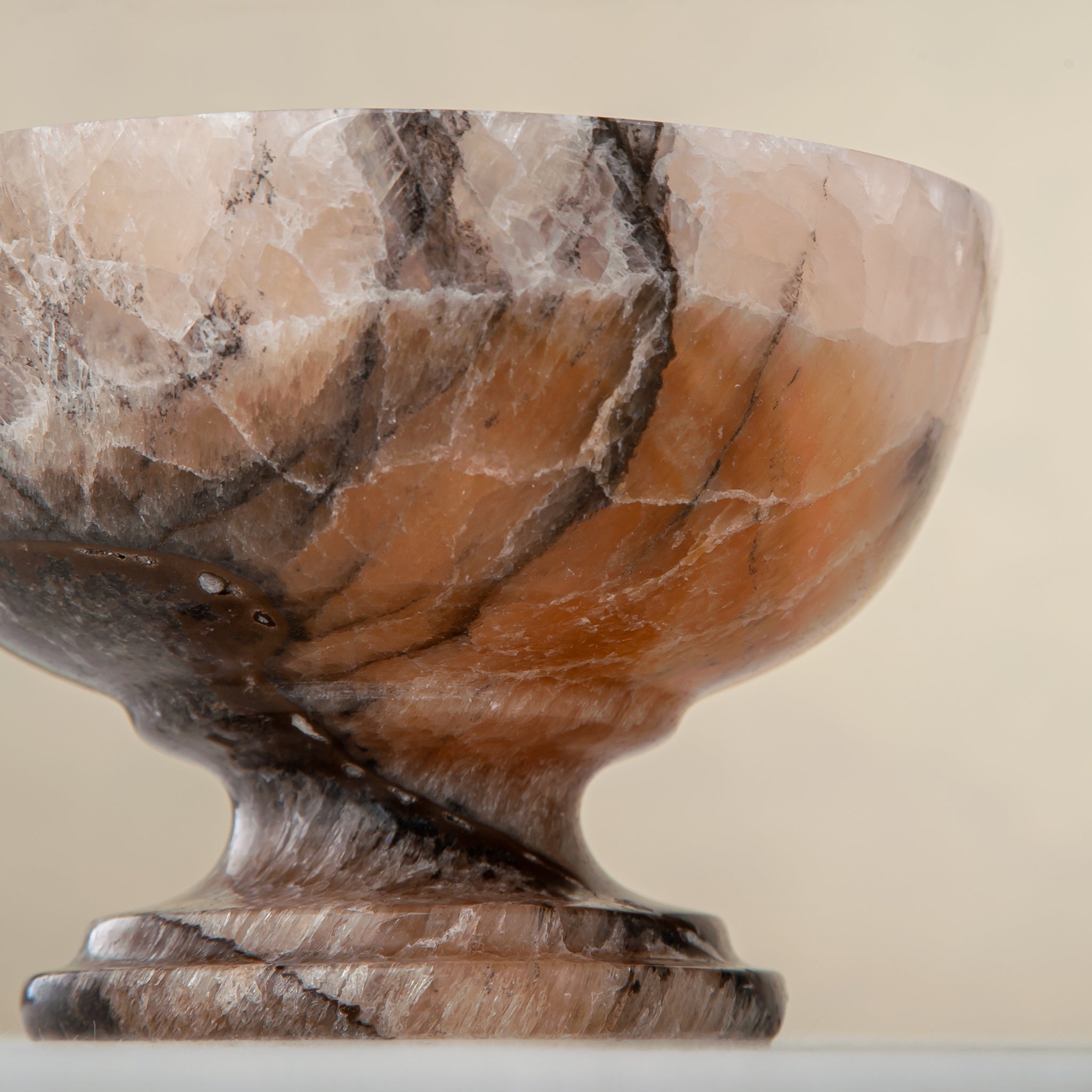 natural stone onyx bowl with warm hues and organic veining for modern interior styling
