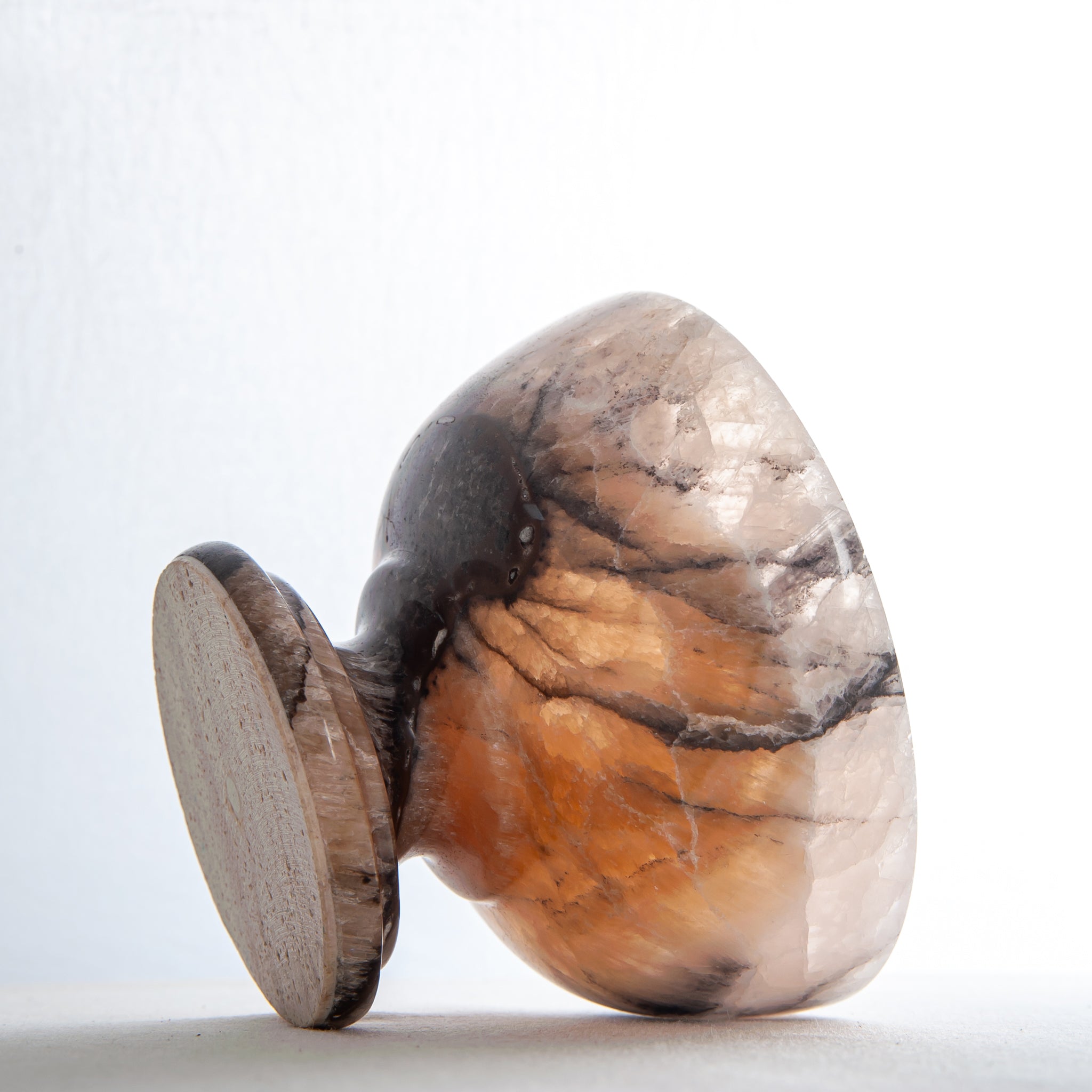 natural stone onyx bowl with warm hues and organic veining for modern interior styling
