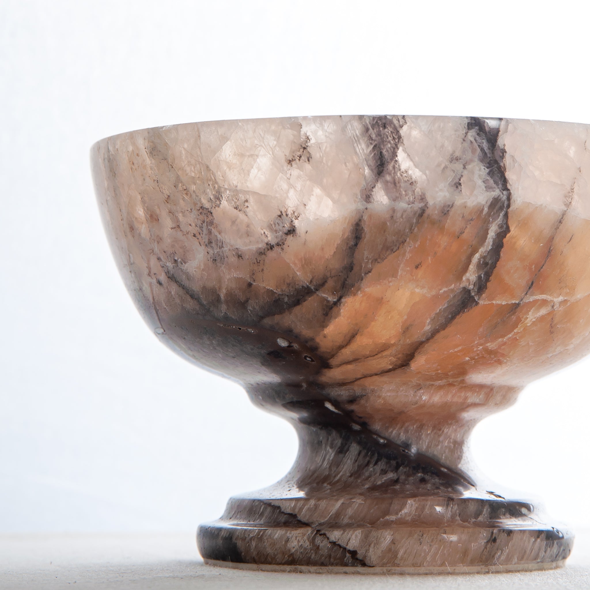 natural stone onyx bowl with warm hues and organic veining for modern interior styling
