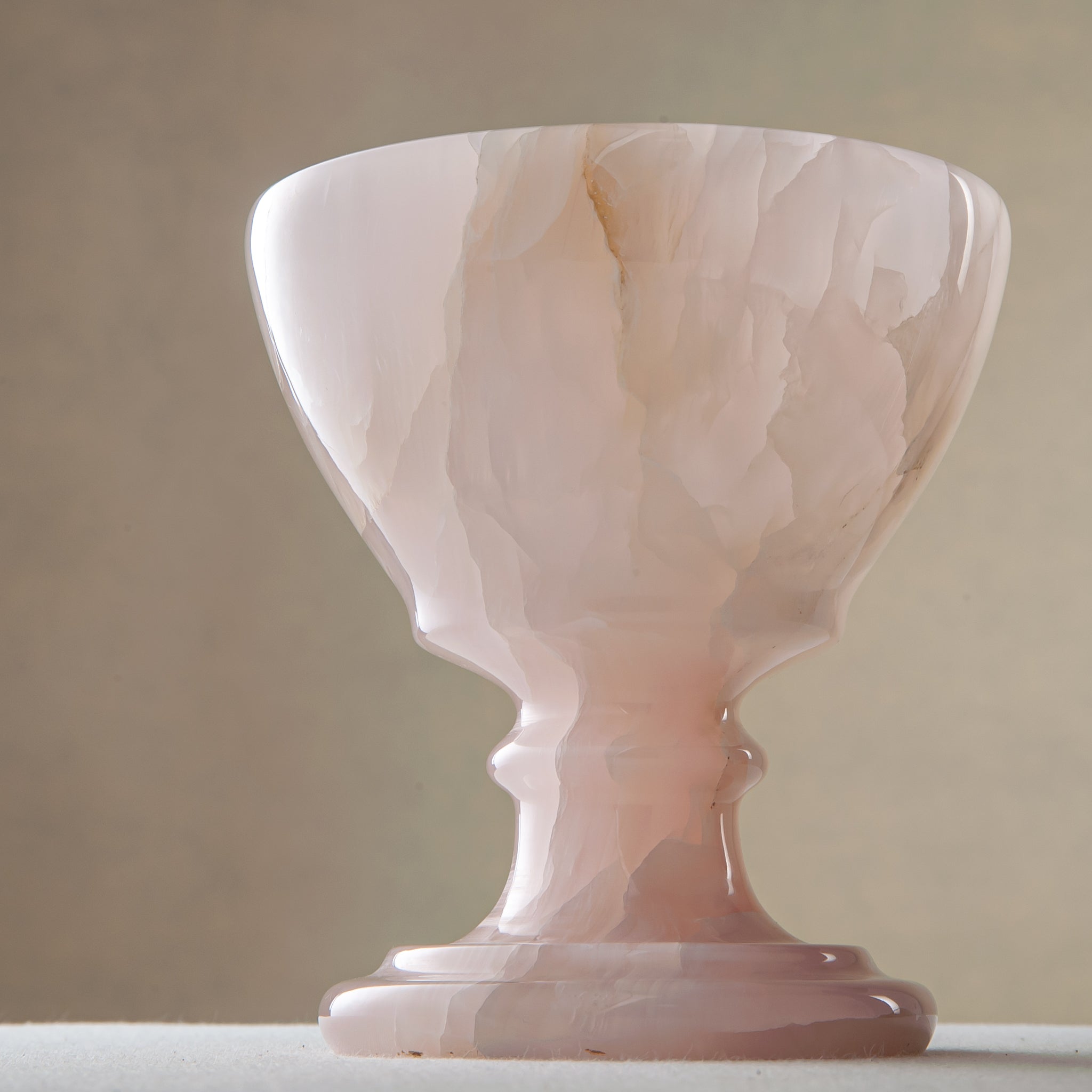 handcrafted onyx bowl blush pink translucent stone elegant pedestal design
