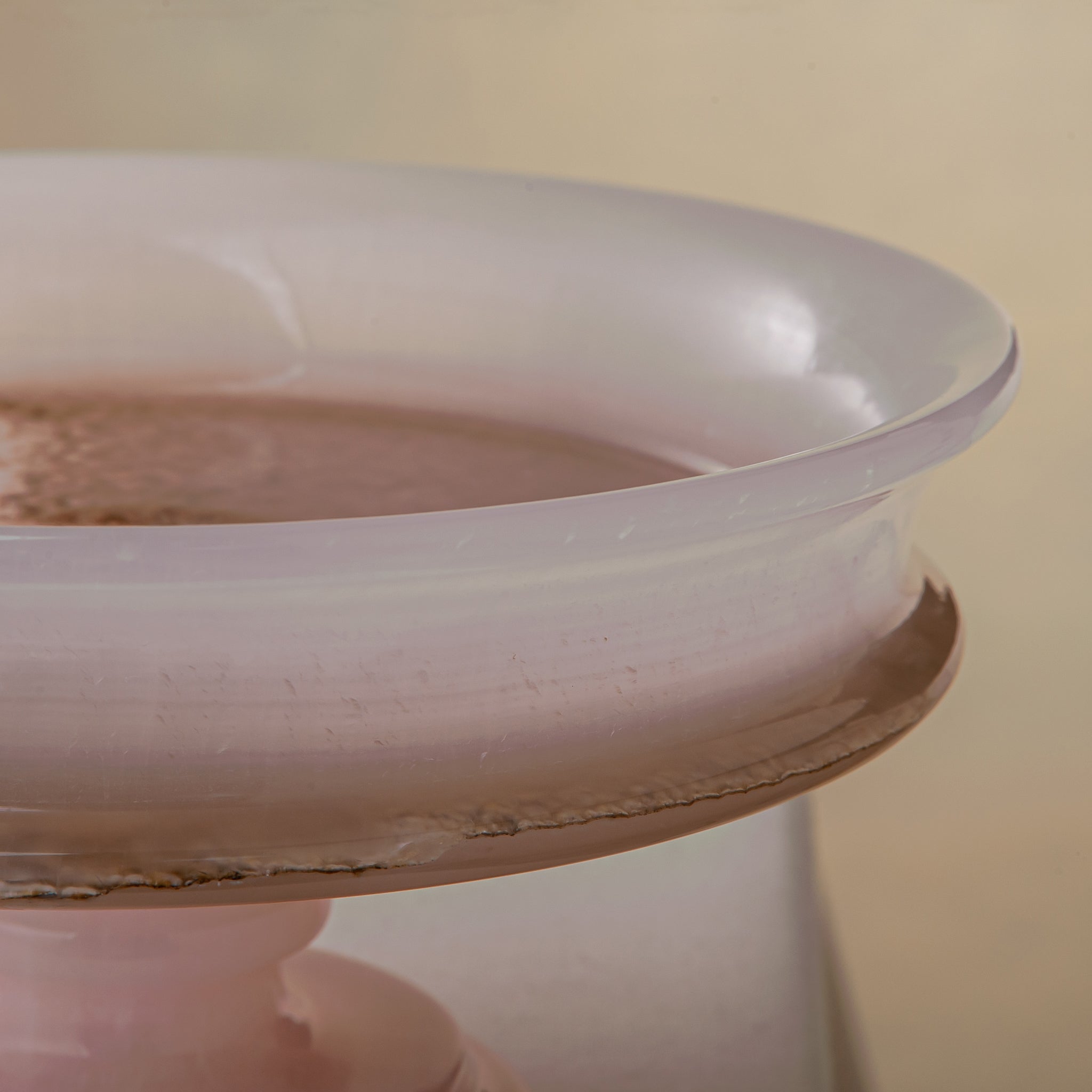 handcrafted onyx bowl with blush pink tones and translucent layered stone on pedestal for luxury decor
