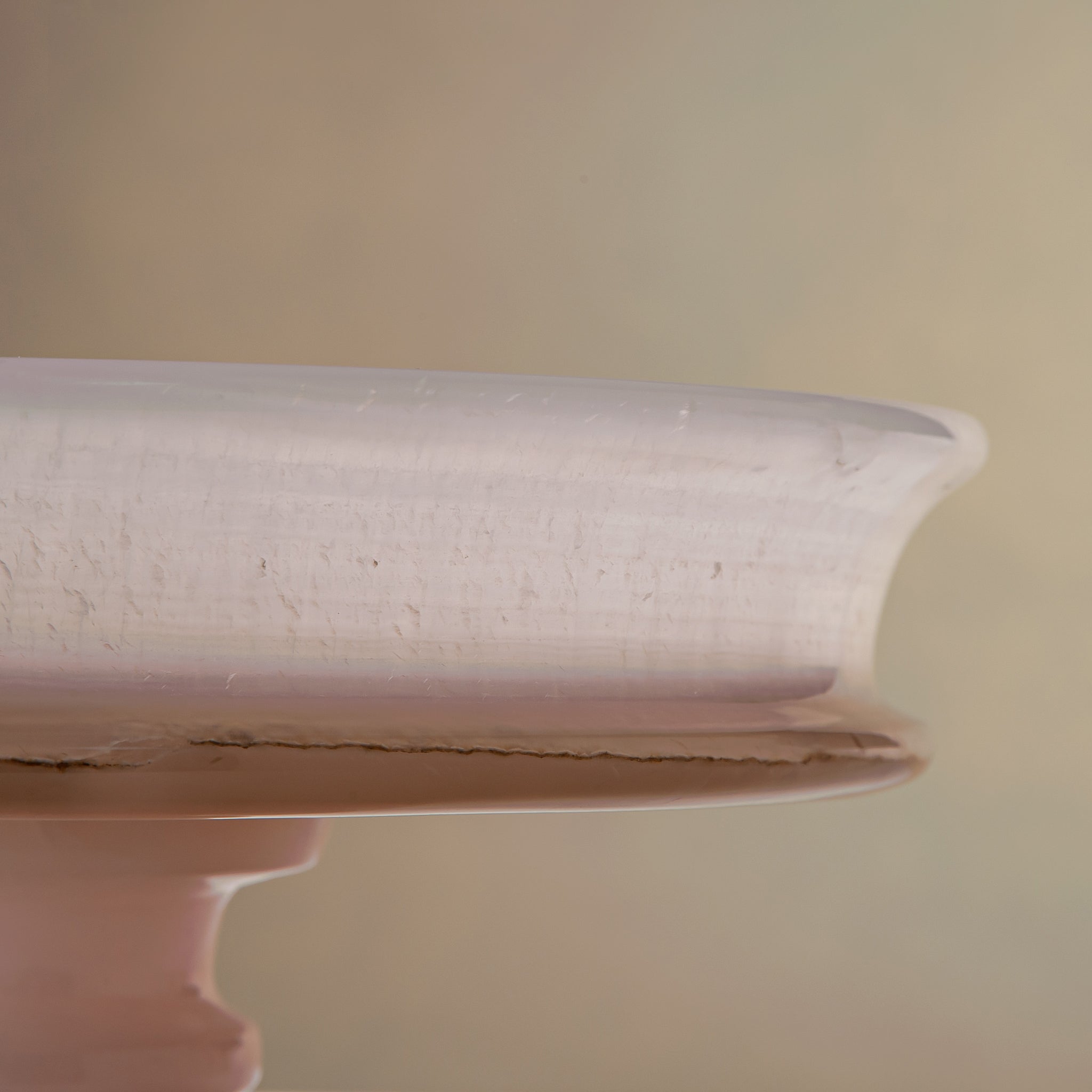handcrafted onyx bowl with blush pink tones and translucent layered stone on pedestal for luxury decor
