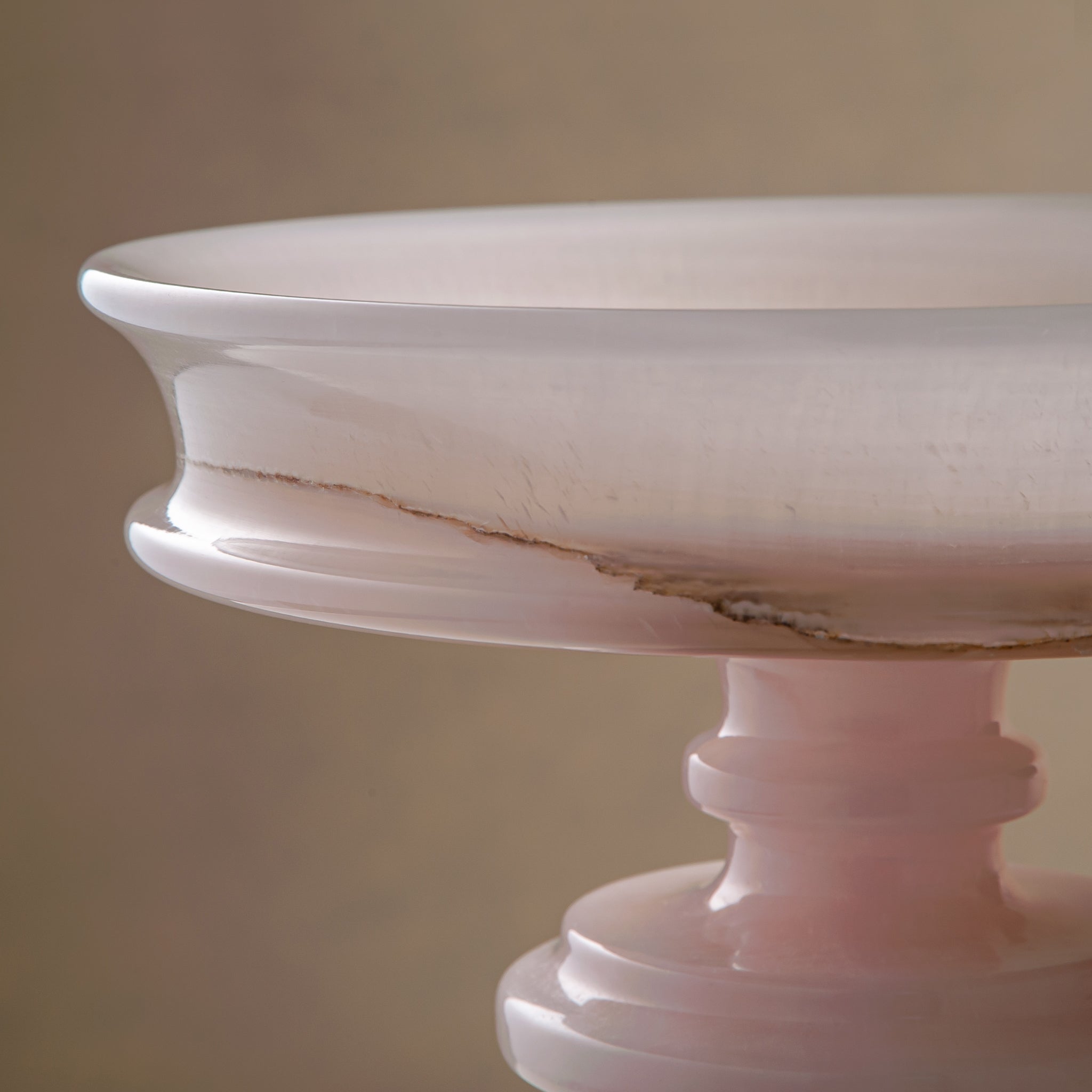 handcrafted onyx bowl with blush pink tones and translucent layered stone on pedestal for luxury decor
