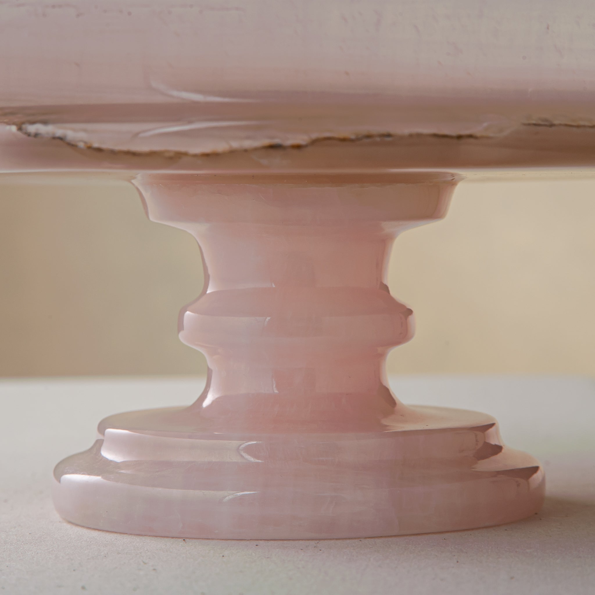 handcrafted onyx bowl with blush pink tones and translucent layered stone on pedestal for luxury decor
