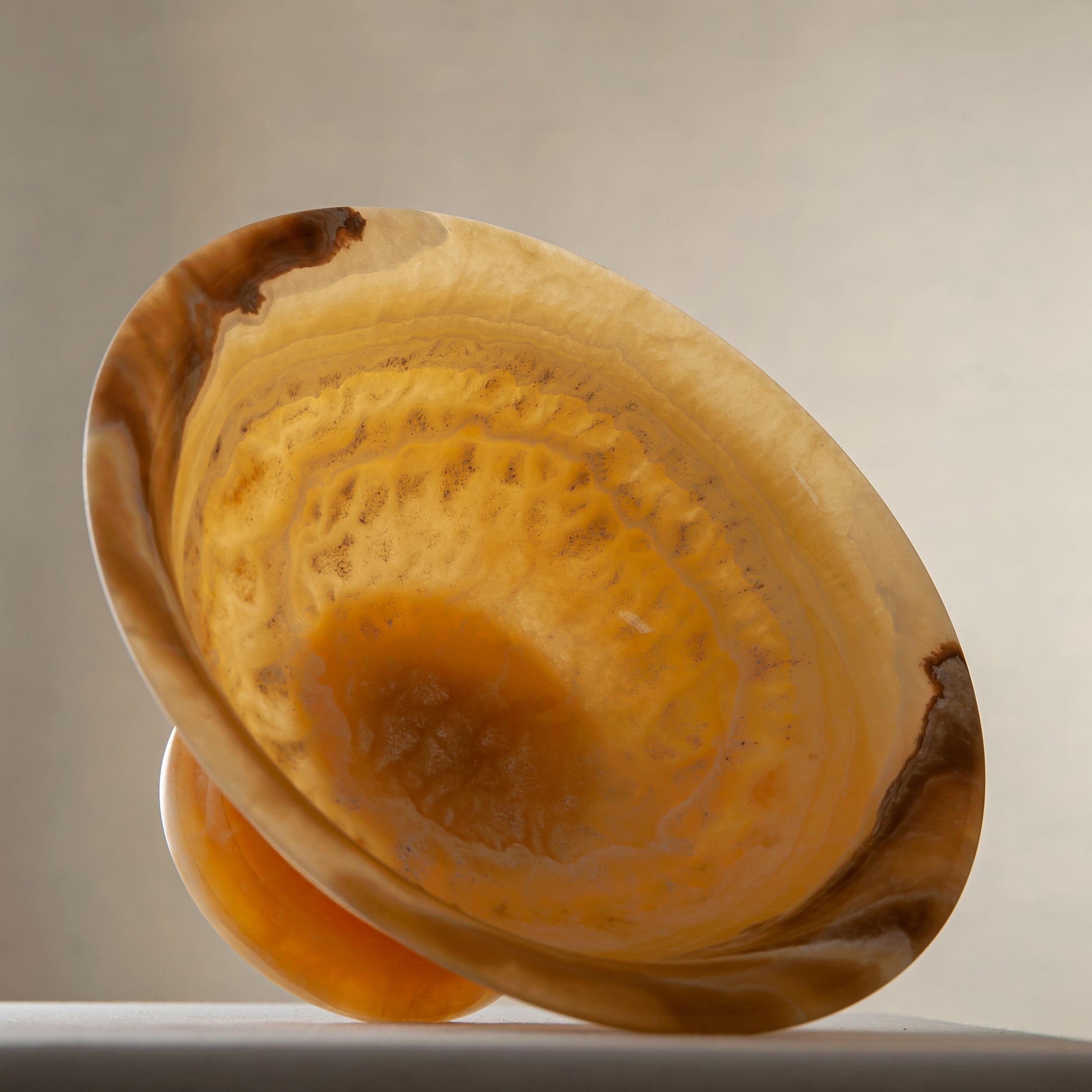 handcrafted onyx bowl with golden tones and caramel veining for luxury table decor
