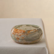 handcrafted onyx bowl with green and amber veining for luxury table decor
