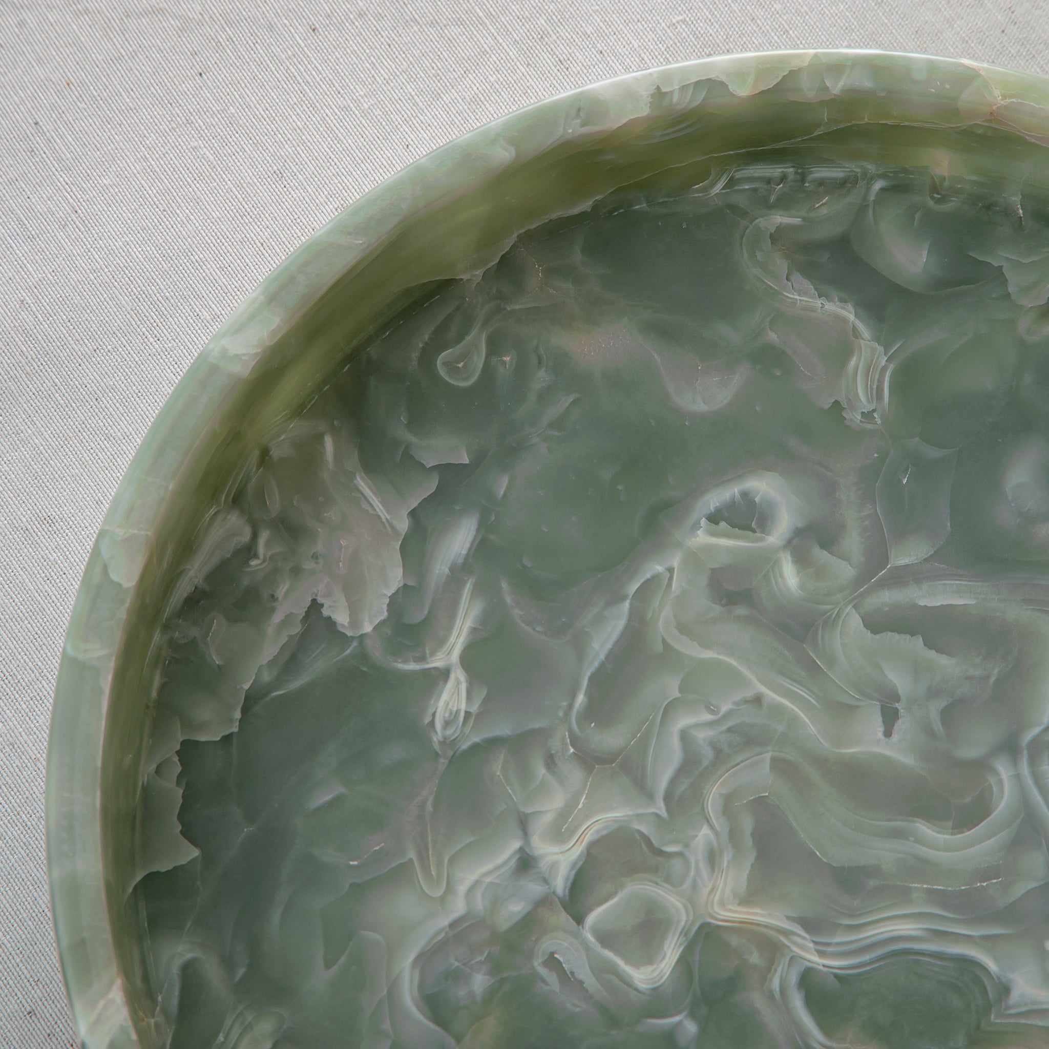 handcrafted onyx bowl with soft green tones and delicate white veining for elegant table decor
