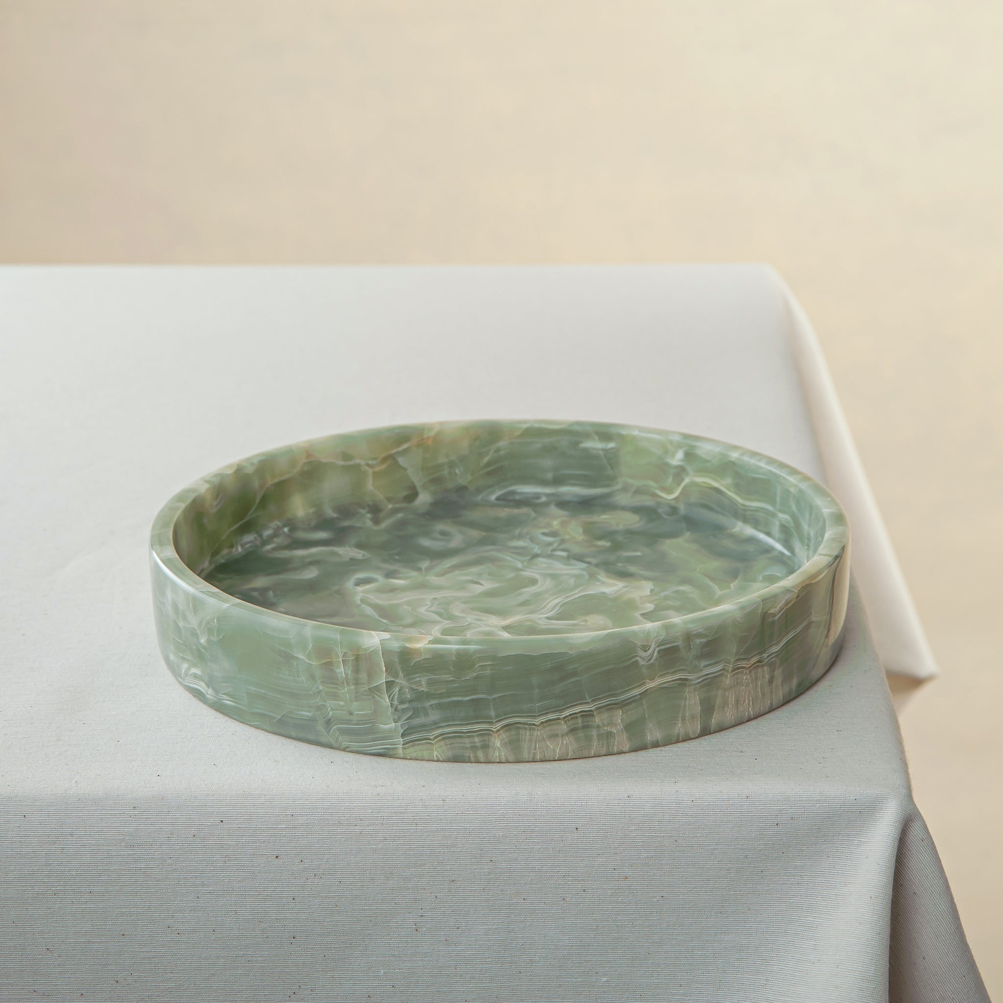 handcrafted onyx bowl with soft green tones and delicate white veining for elegant table decor
