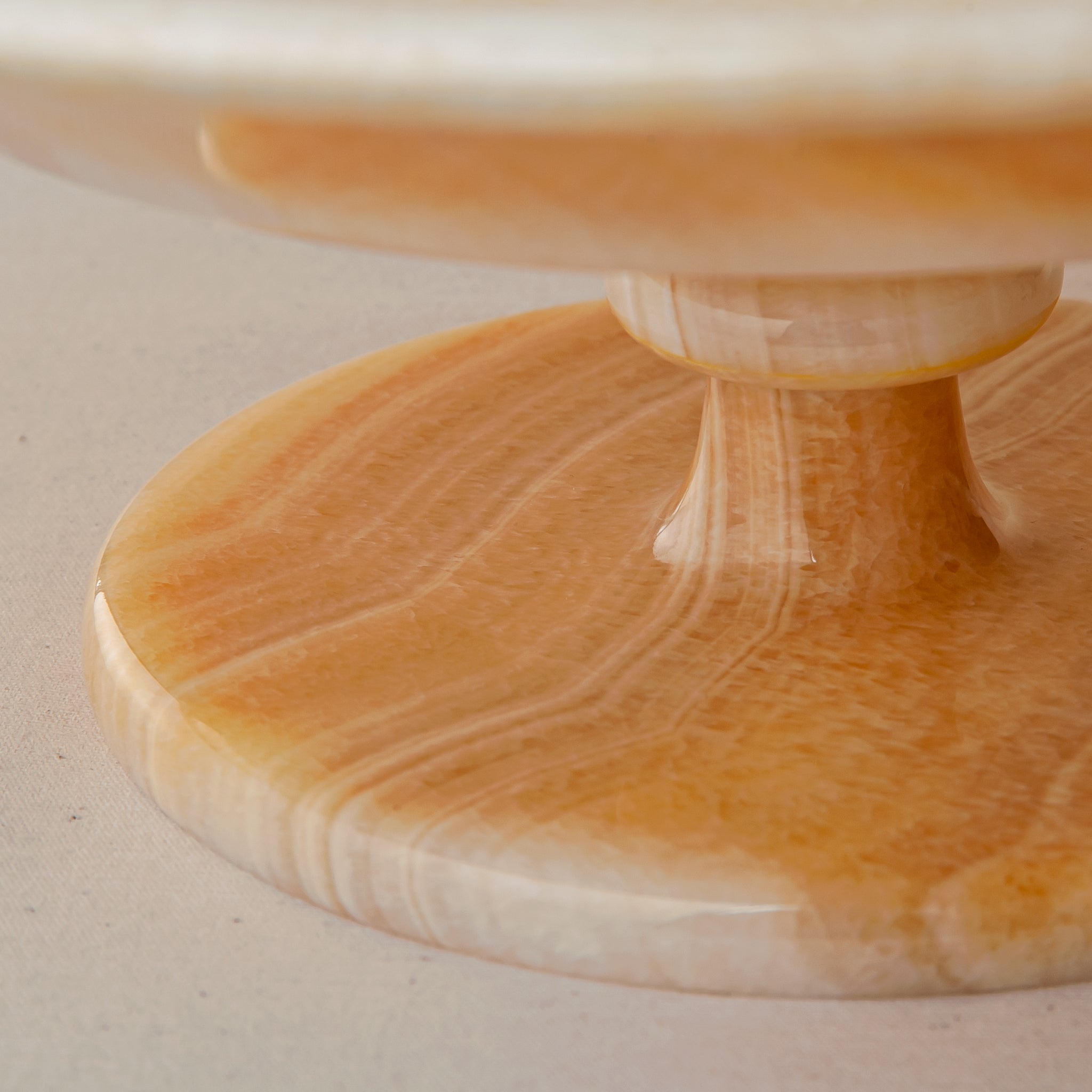 unique natural onyx bowl with warm flowing layers and luminous surface centerpiece
