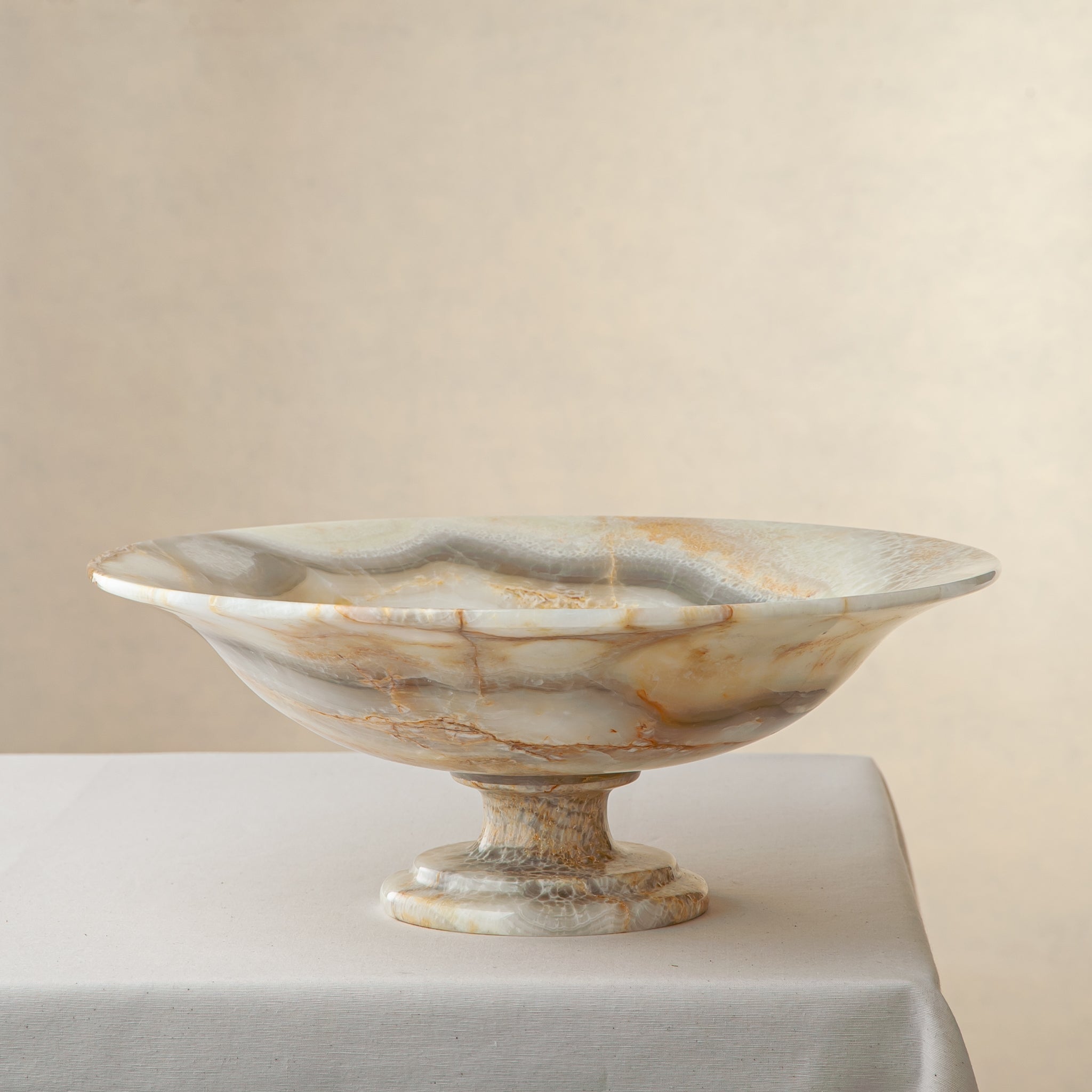 handcrafted onyx bowl with honey and ivory veining and translucent layered texture for luxury decor
