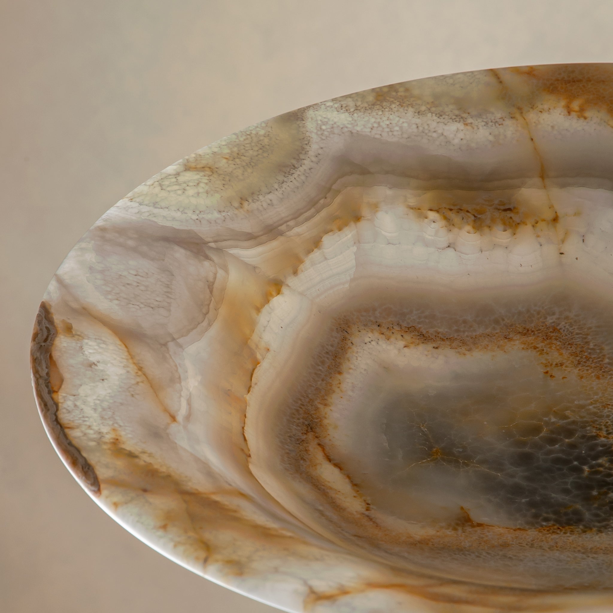 handcrafted onyx bowl with honey and ivory veining and translucent layered texture for luxury decor
