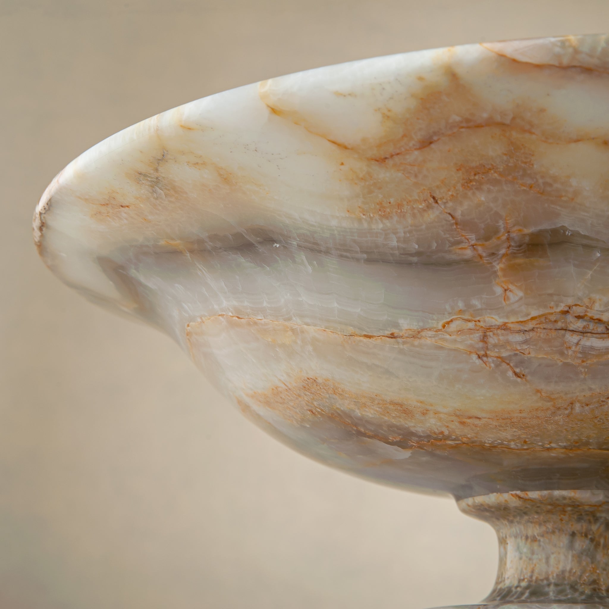 handcrafted onyx bowl with honey and ivory veining and translucent layered texture for luxury decor
