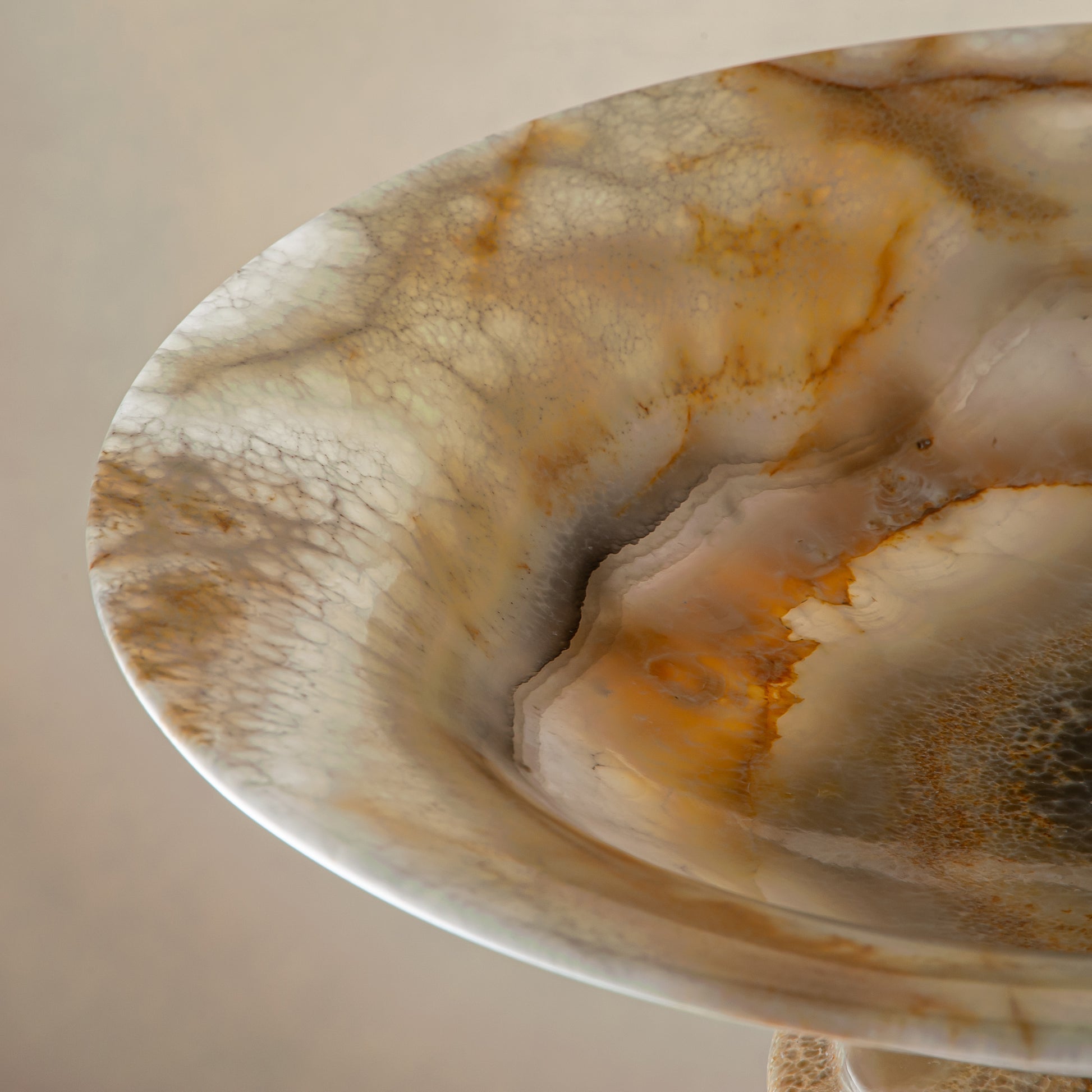 handcrafted onyx bowl with honey and ivory veining and translucent layered texture for luxury decor
