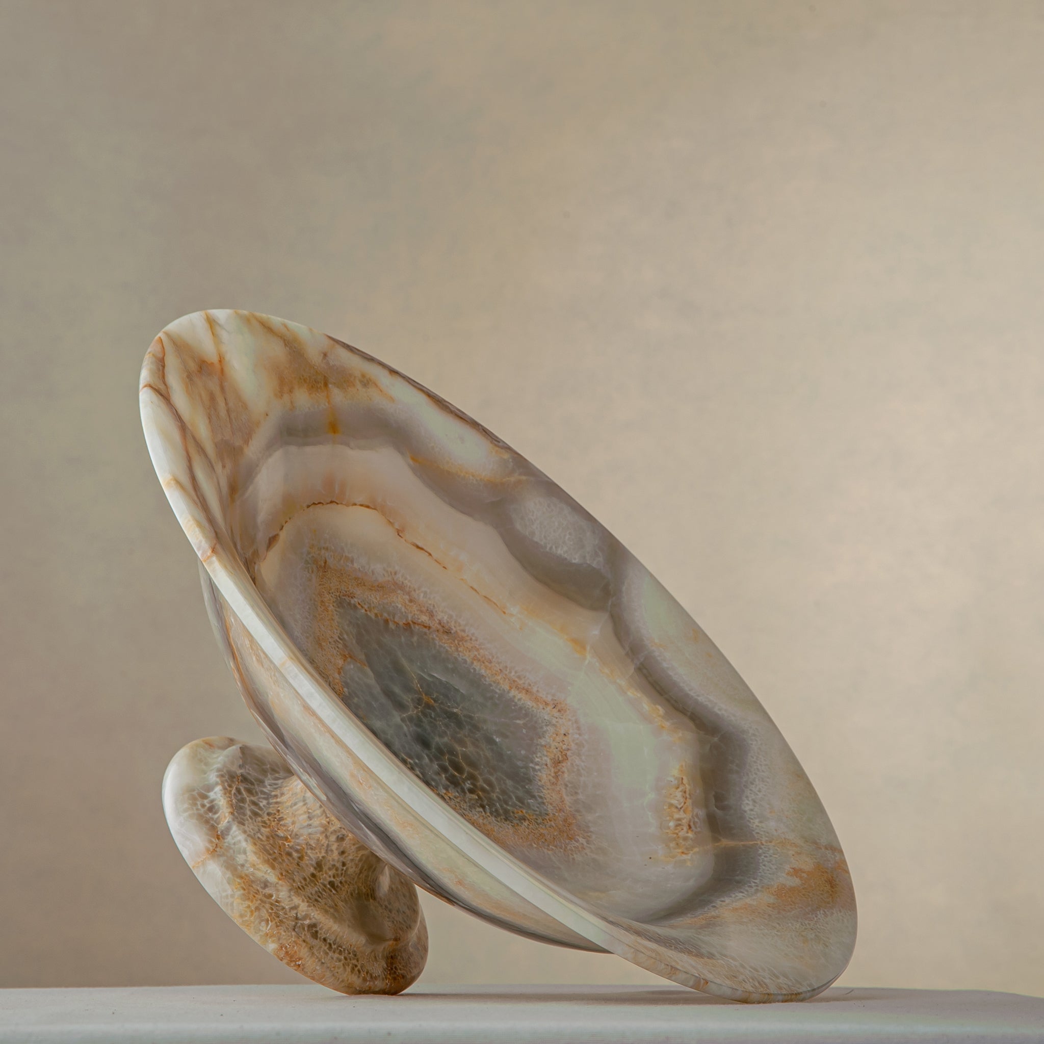 handcrafted onyx bowl with honey and ivory veining and translucent layered texture for luxury decor
