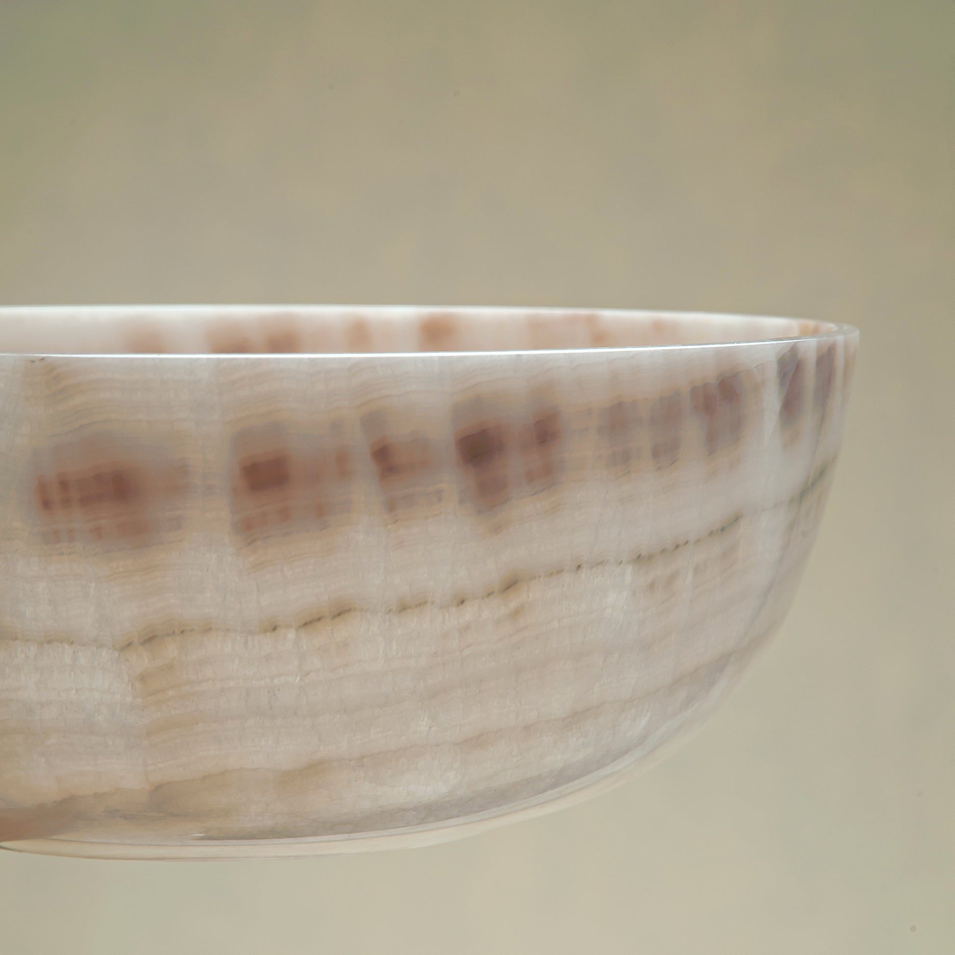 handcrafted onyx bowl with ivory and blush beige tones and soft translucent layers for elegant decor
