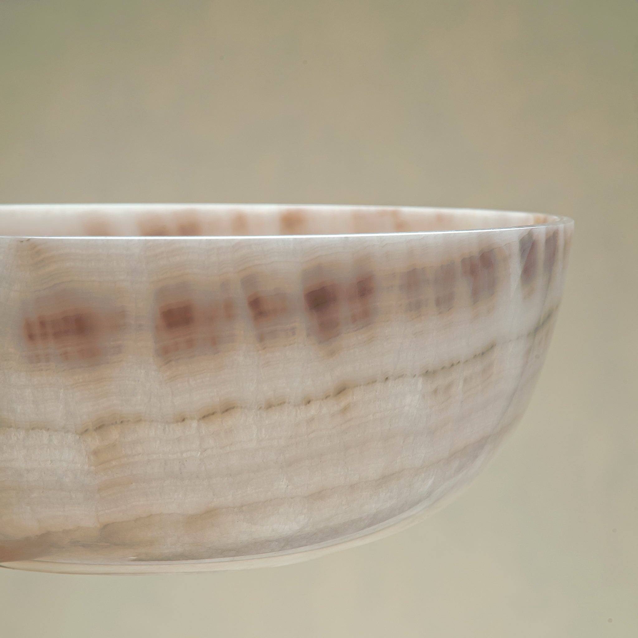 handcrafted onyx bowl with ivory and blush beige tones and soft translucent layers for elegant decor
