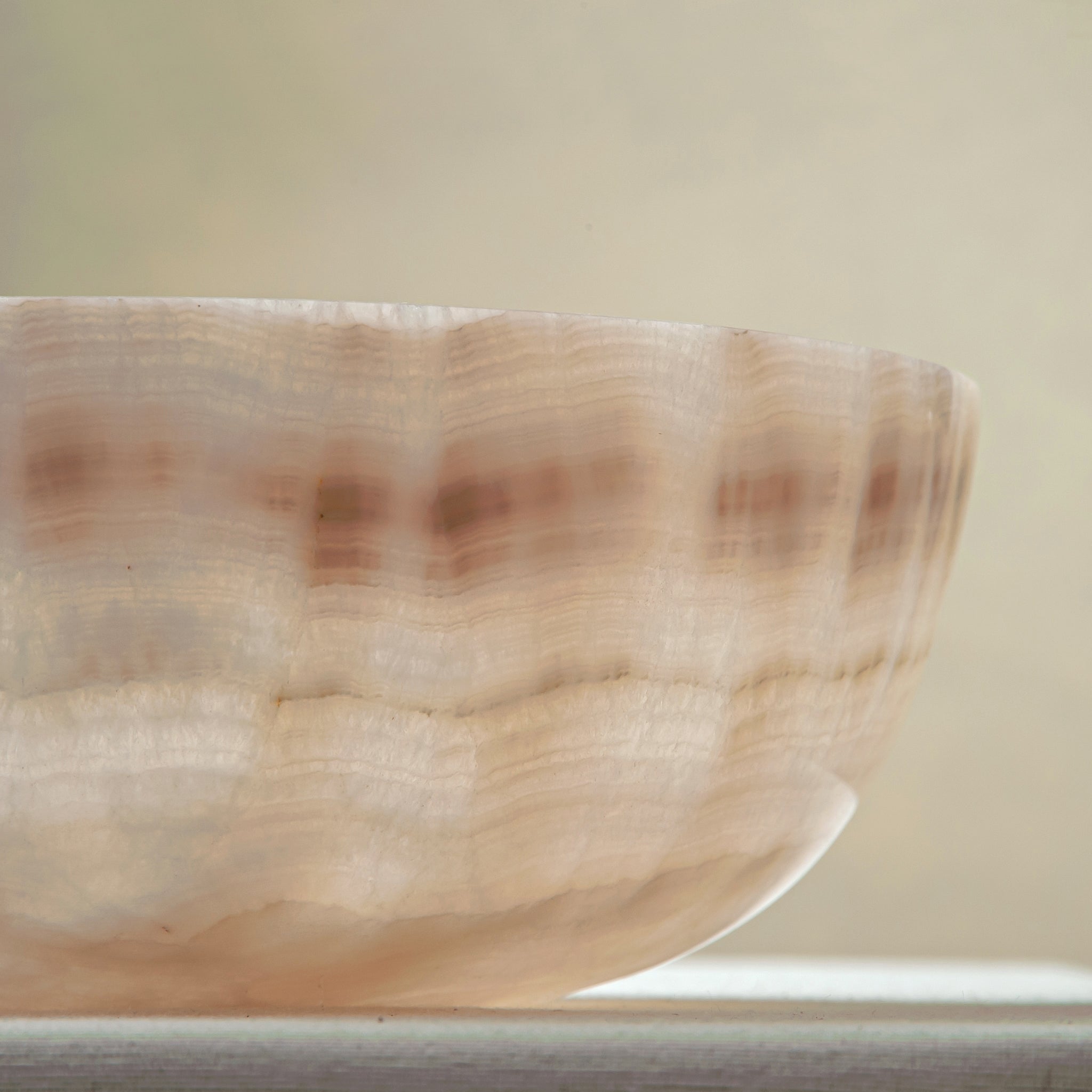 handcrafted onyx bowl with ivory and blush beige tones and soft translucent layers for elegant decor
