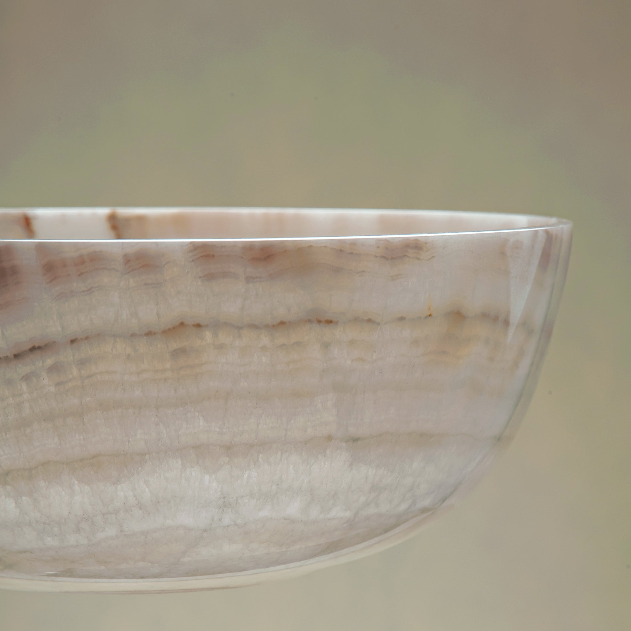 handcrafted onyx bowl with ivory and blush beige tones and soft translucent layers for elegant decor
