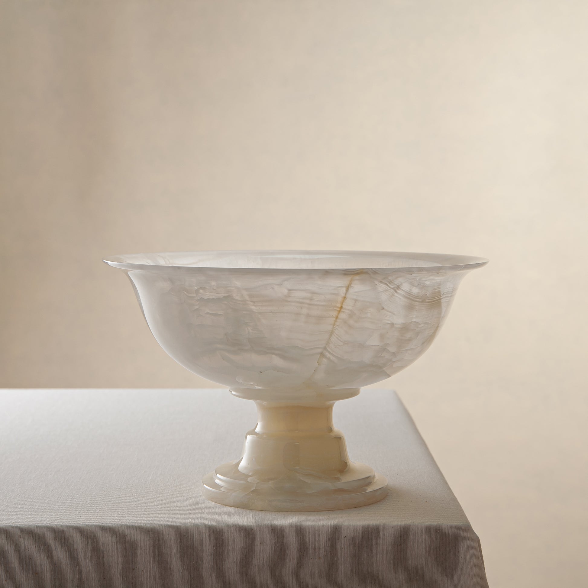 handcrafted onyx bowl with ivory translucency and subtle linear veining for luxury decor
