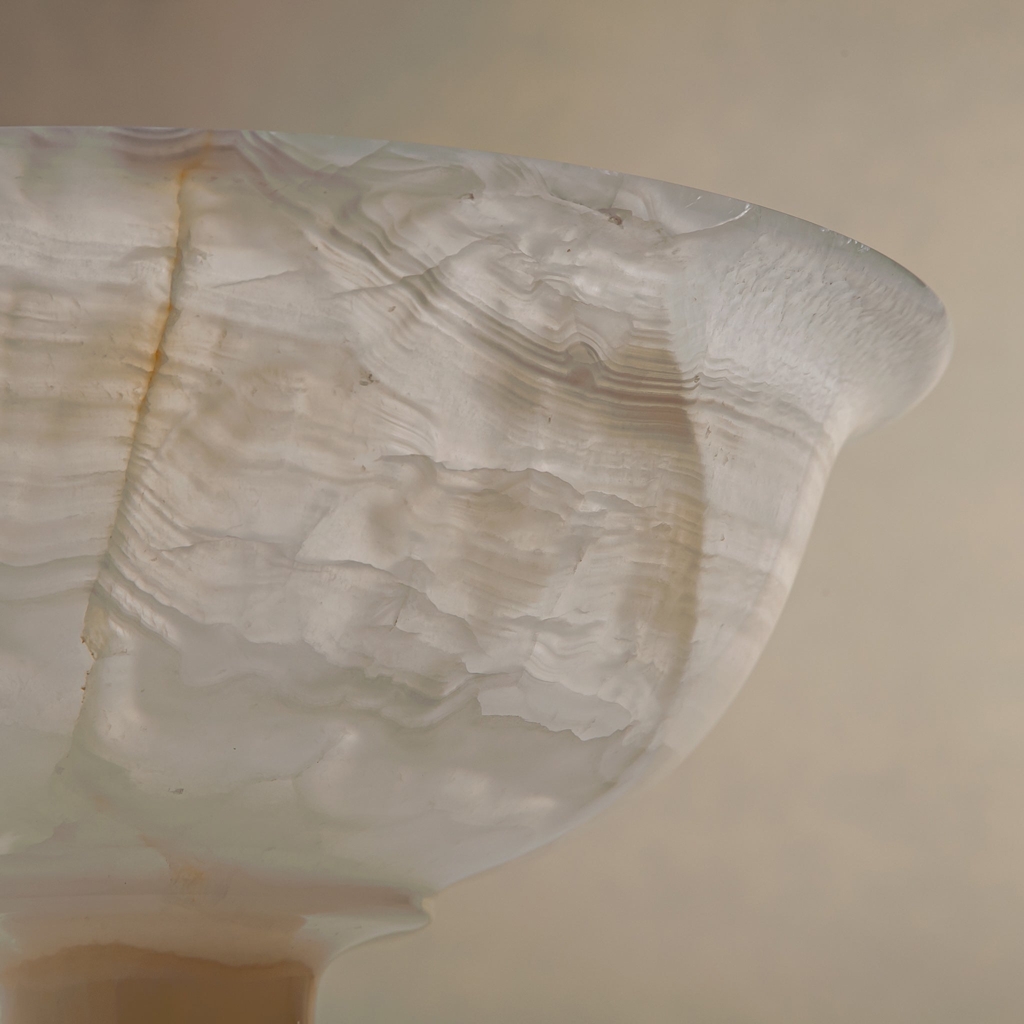 handcrafted onyx bowl with ivory translucency and subtle linear veining for luxury decor
