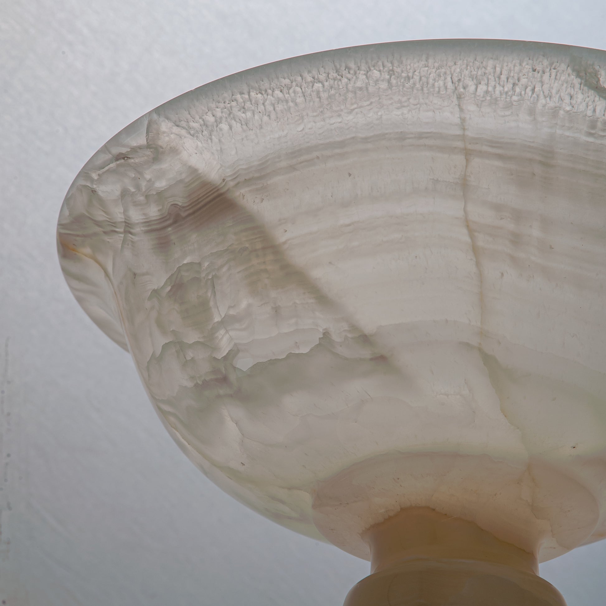 handcrafted onyx bowl with ivory translucency and subtle linear veining for luxury decor
