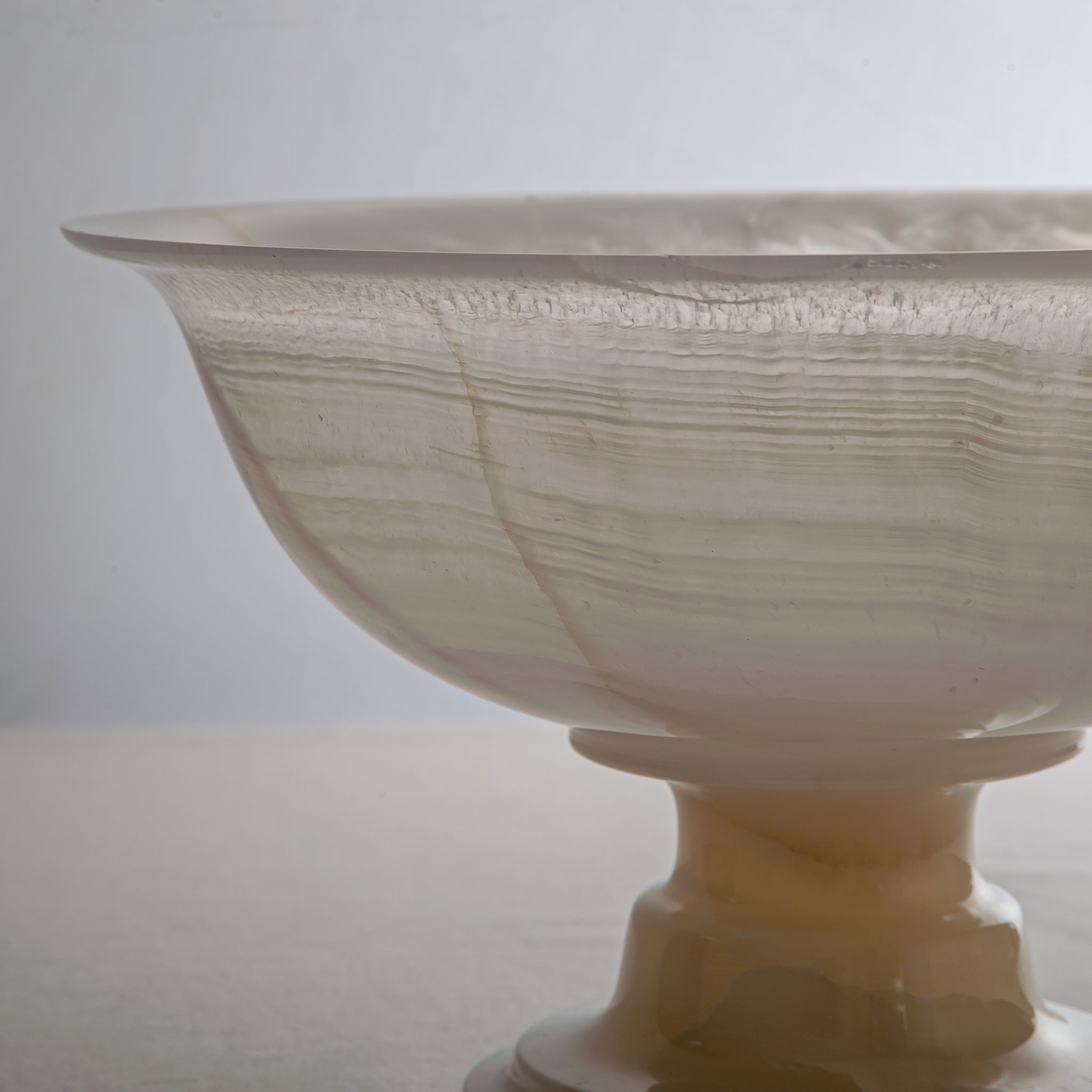 handcrafted onyx bowl with ivory translucency and subtle linear veining for luxury decor
