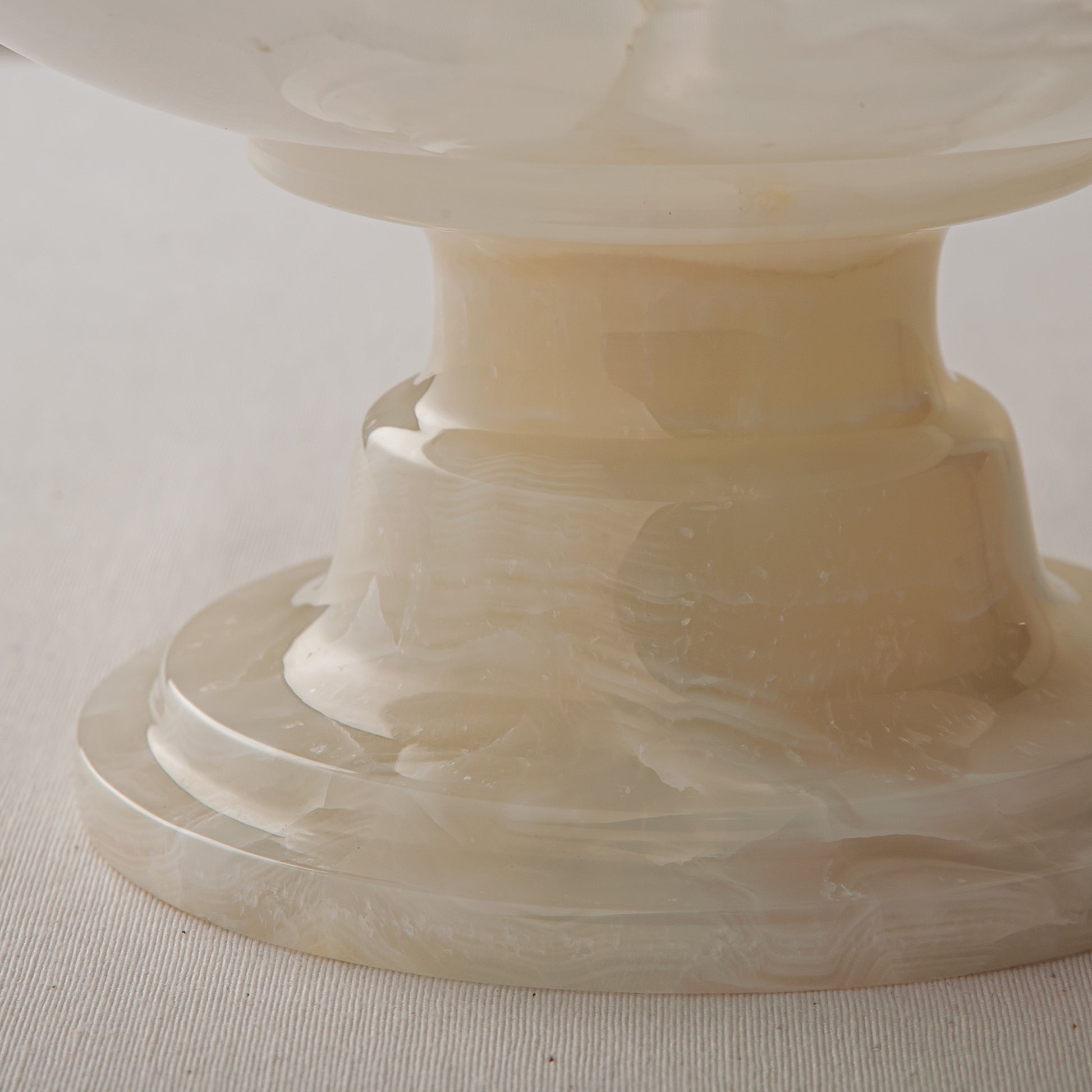 handcrafted onyx bowl with ivory translucency and subtle linear veining for luxury decor
