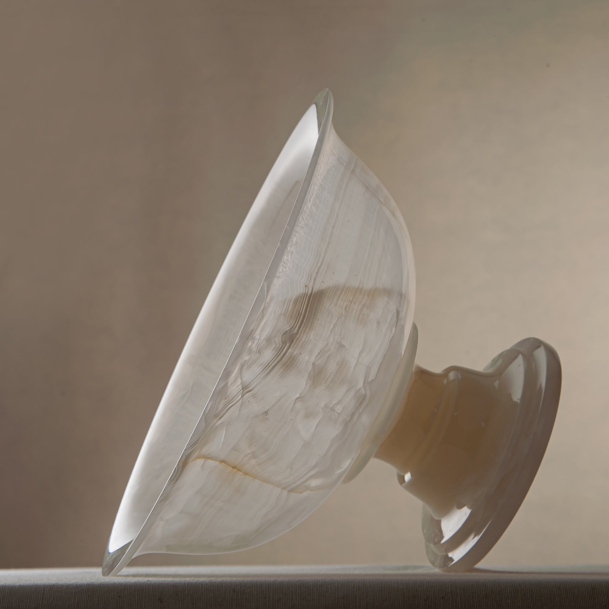 handcrafted onyx bowl with ivory translucency and subtle linear veining for luxury decor
