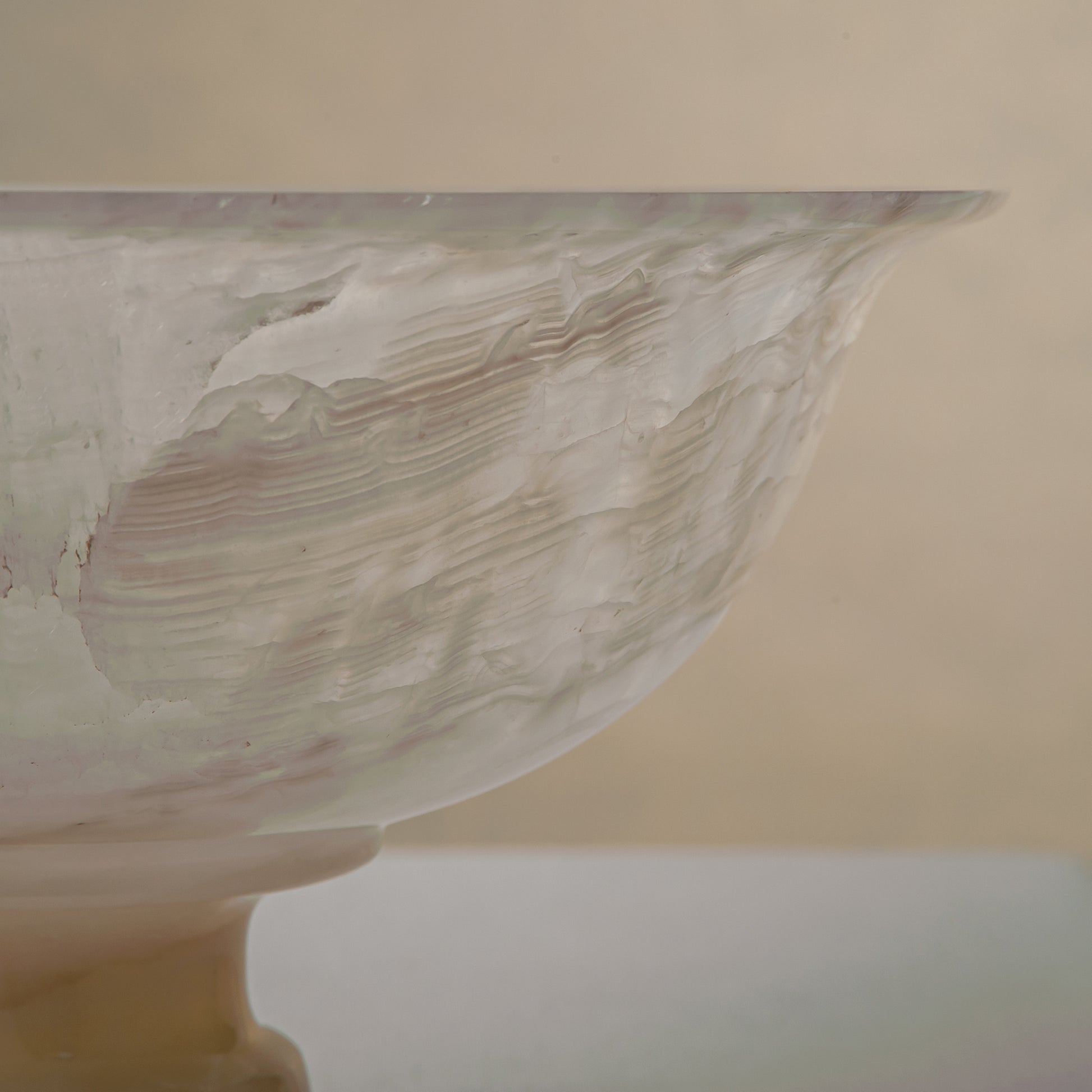 handcrafted onyx bowl with ivory translucency and subtle linear veining for luxury decor

