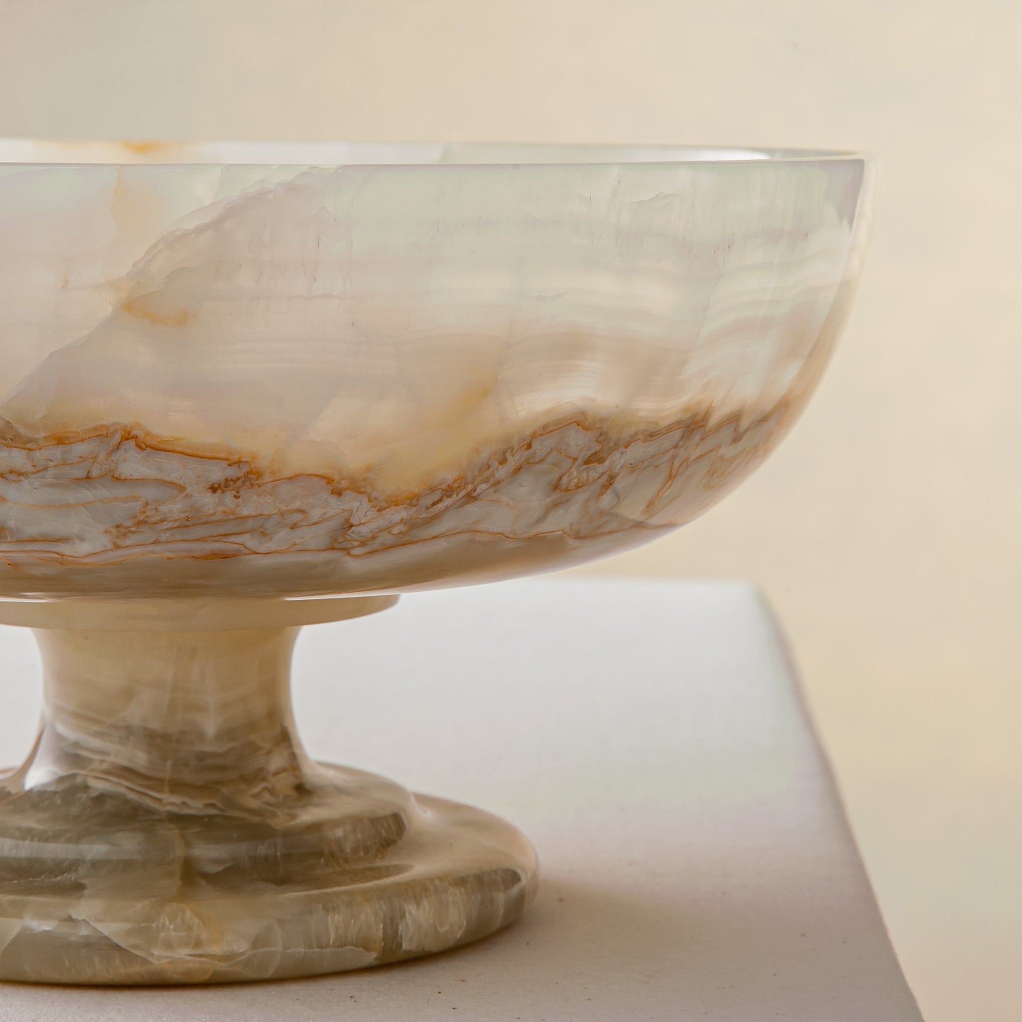 handcrafted onyx bowl with ivory tones and soft translucent layers for elegant decor
