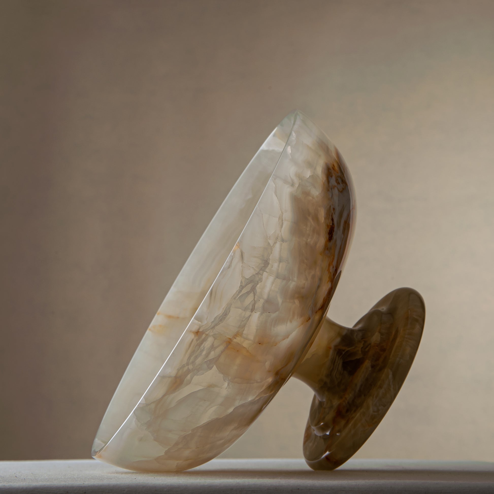handcrafted onyx bowl with ivory tones and soft translucent layers for elegant decor

