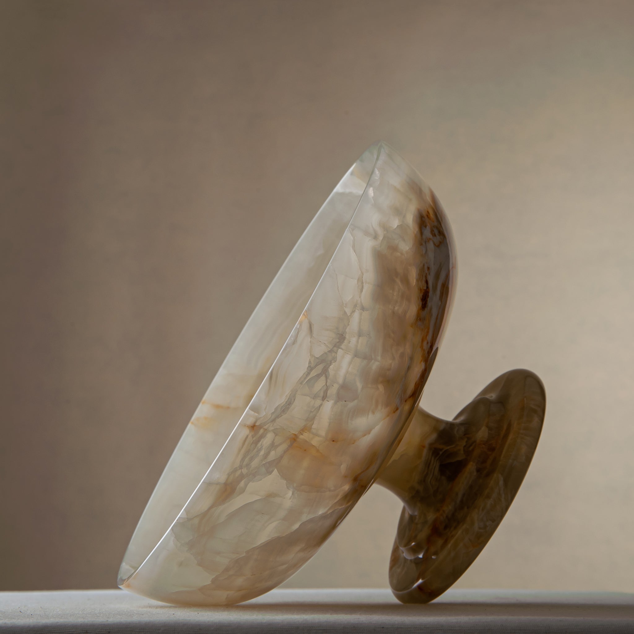 handcrafted onyx bowl with ivory tones and soft translucent layers for elegant decor
