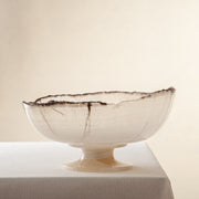 handcrafted onyx bowl in translucent ivory stone with natural rugged edge for luxury decor

