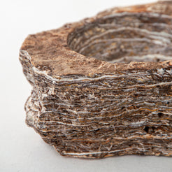 handcrafted onyx bowl with layered brown and ivory bands as sculptural centerpiece
