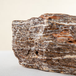 handcrafted onyx bowl with layered brown and ivory bands as sculptural centerpiece
