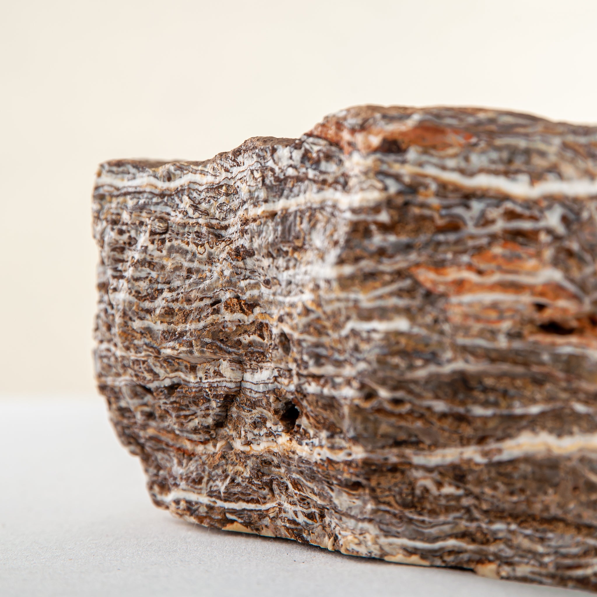 handcrafted onyx bowl with layered brown and ivory bands as sculptural centerpiece
