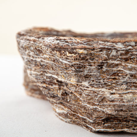 handcrafted onyx bowl with layered brown and ivory bands as sculptural centerpiece
