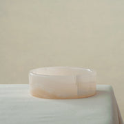 handcrafted onyx bowl in low cylindrical shape with soft white and blush tones for modern decor
