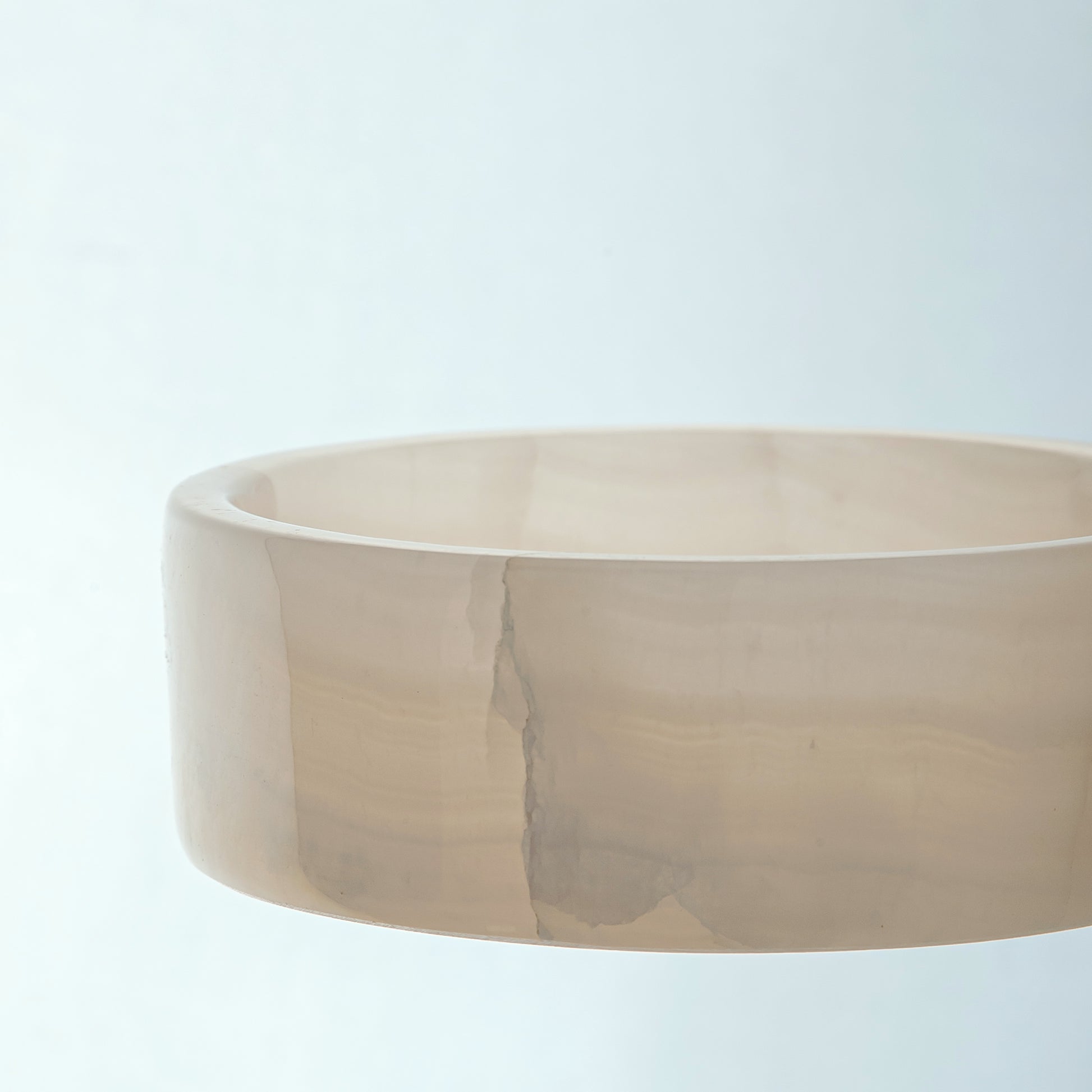 handcrafted onyx bowl in low cylindrical shape with soft white and blush tones for modern decor
