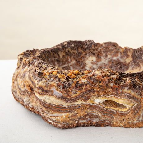 handcrafted onyx bowl with layered amber and ivory veining for luxury table decor
