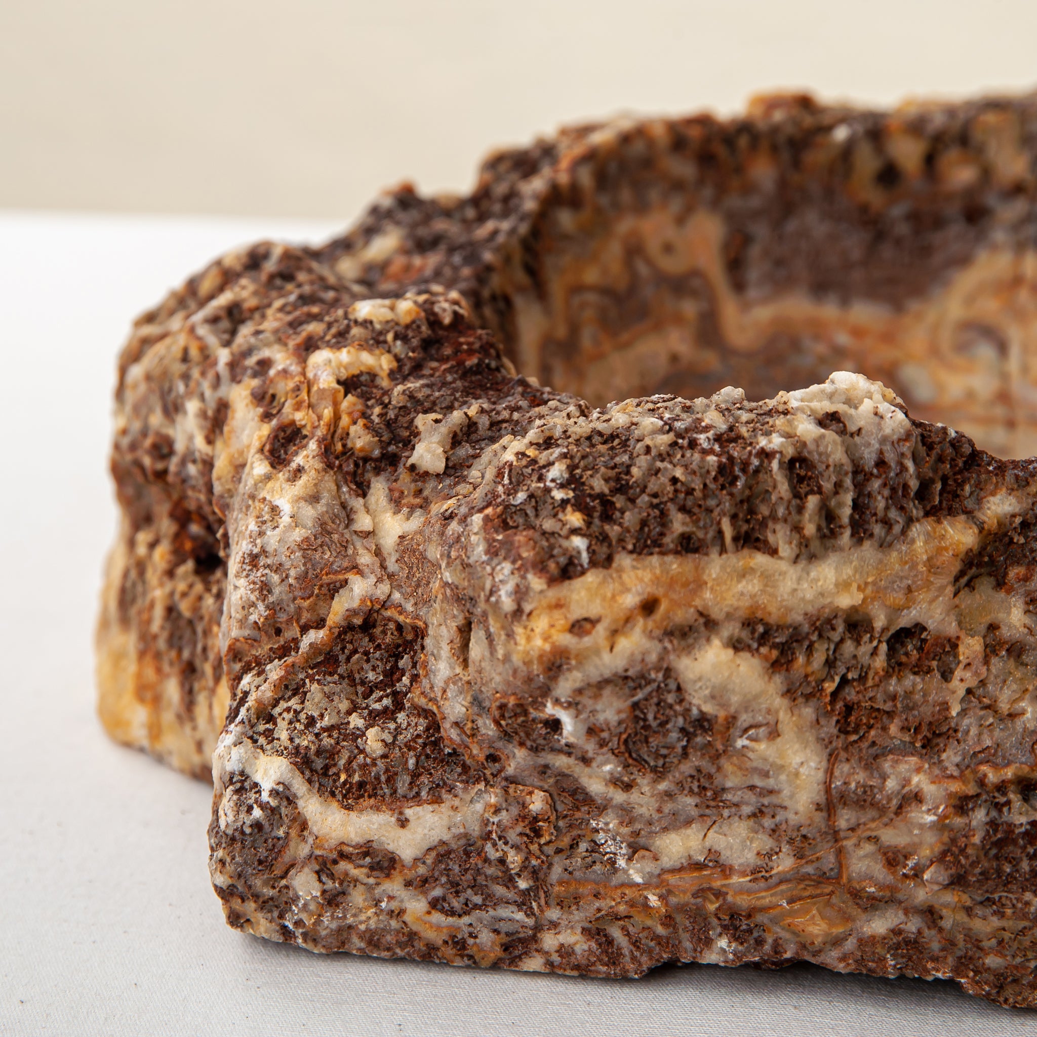 handcrafted onyx bowl with layered amber and ivory veining for luxury table decor
