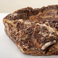 handcrafted onyx bowl with layered amber and ivory veining for luxury table decor
