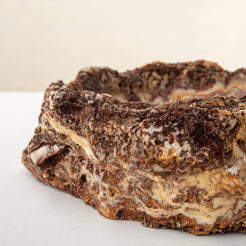 handcrafted onyx bowl with layered amber and ivory veining for luxury table decor
