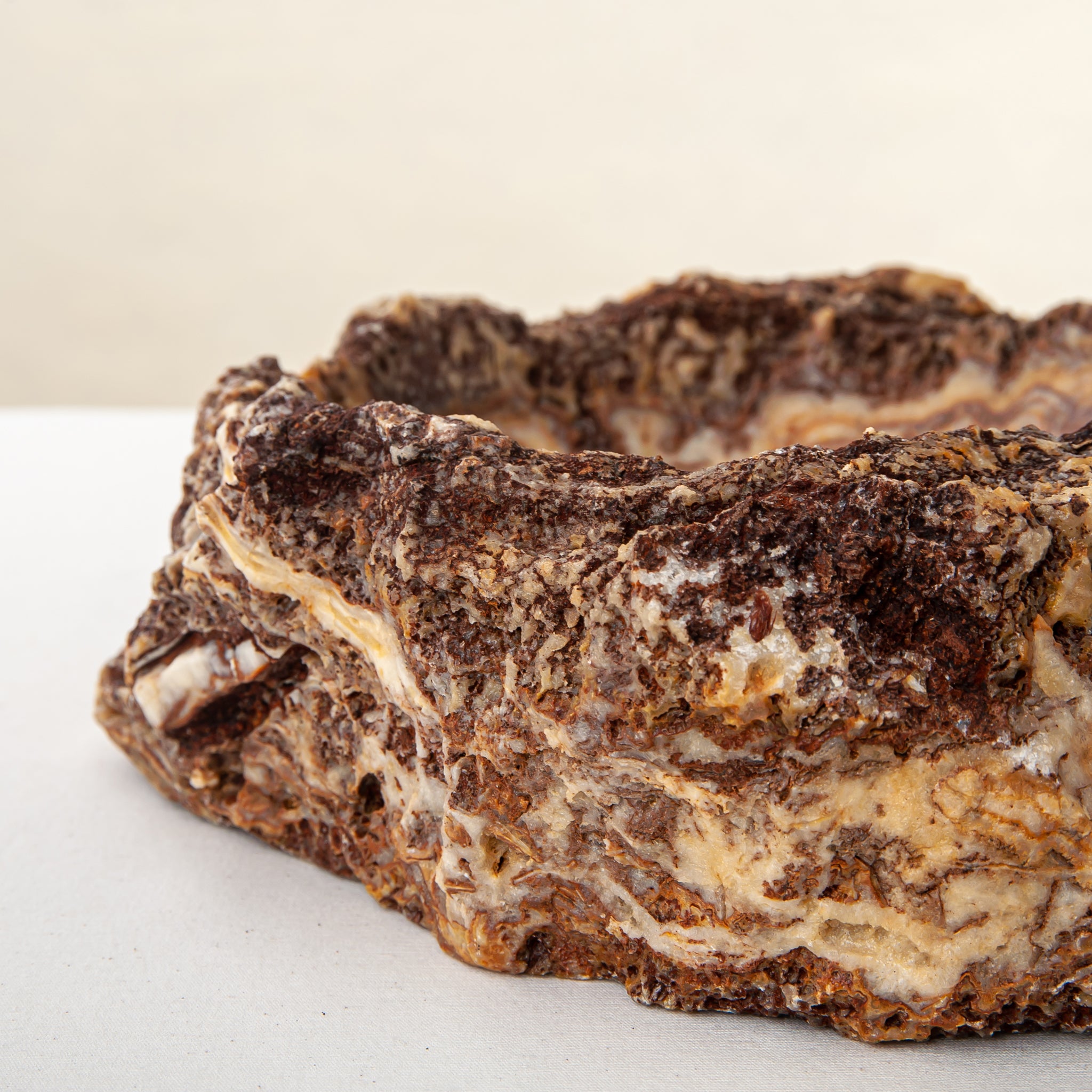 handcrafted onyx bowl with layered amber and ivory veining for luxury table decor
