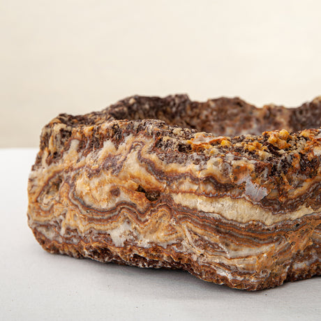 handcrafted onyx bowl with layered amber and ivory veining for luxury table decor
