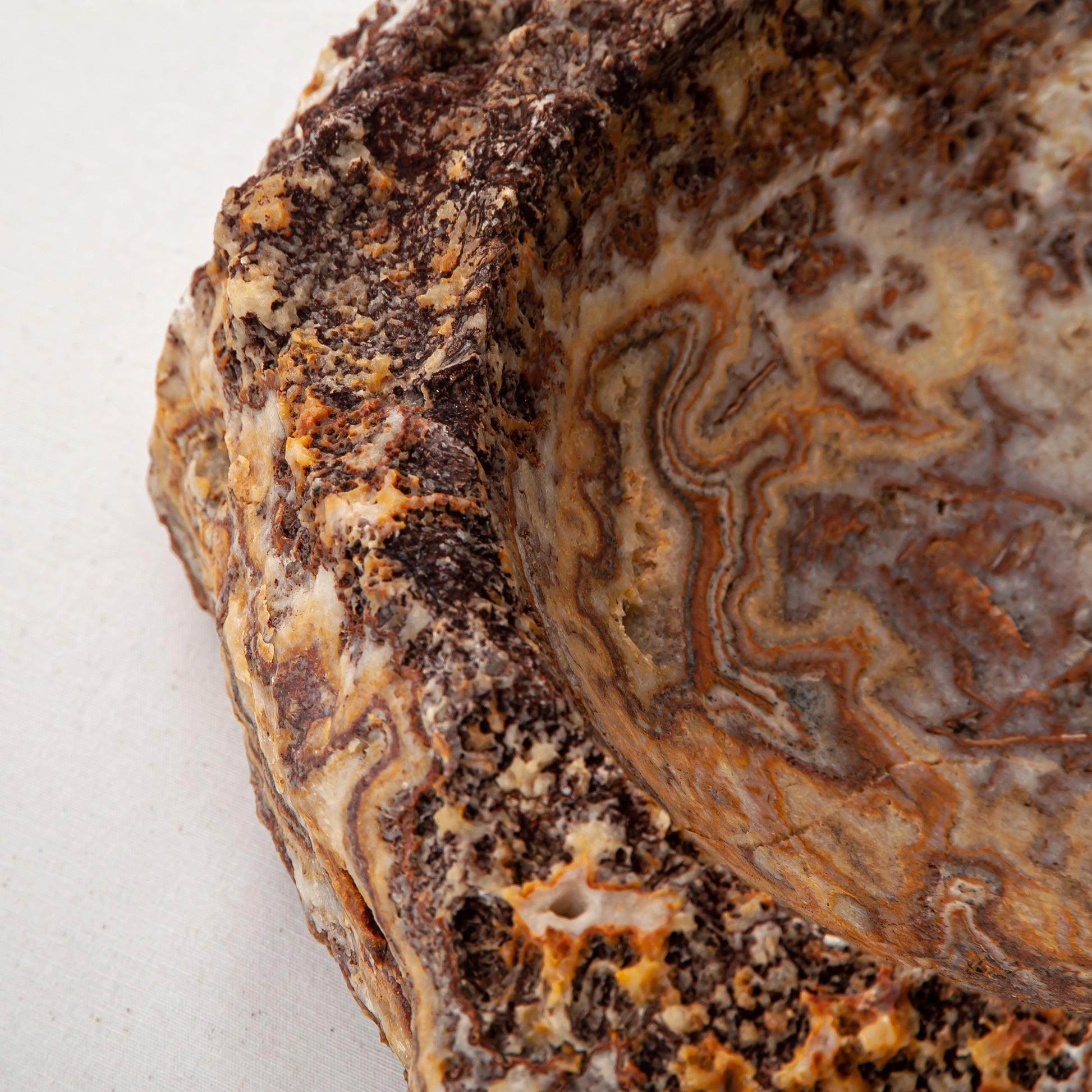 handcrafted onyx bowl with layered amber and ivory veining for luxury table decor
