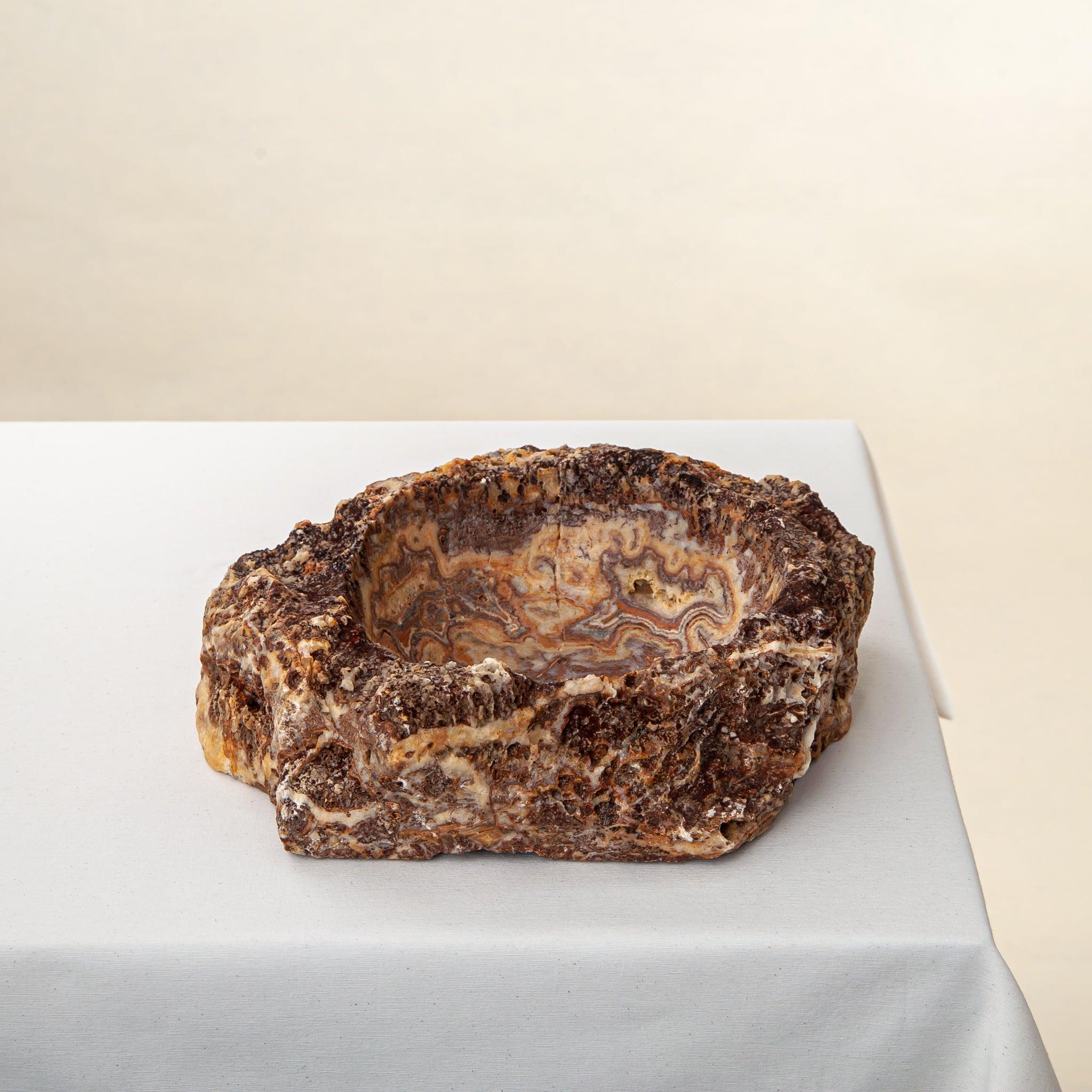 handcrafted onyx bowl with layered amber and ivory veining for luxury table decor
