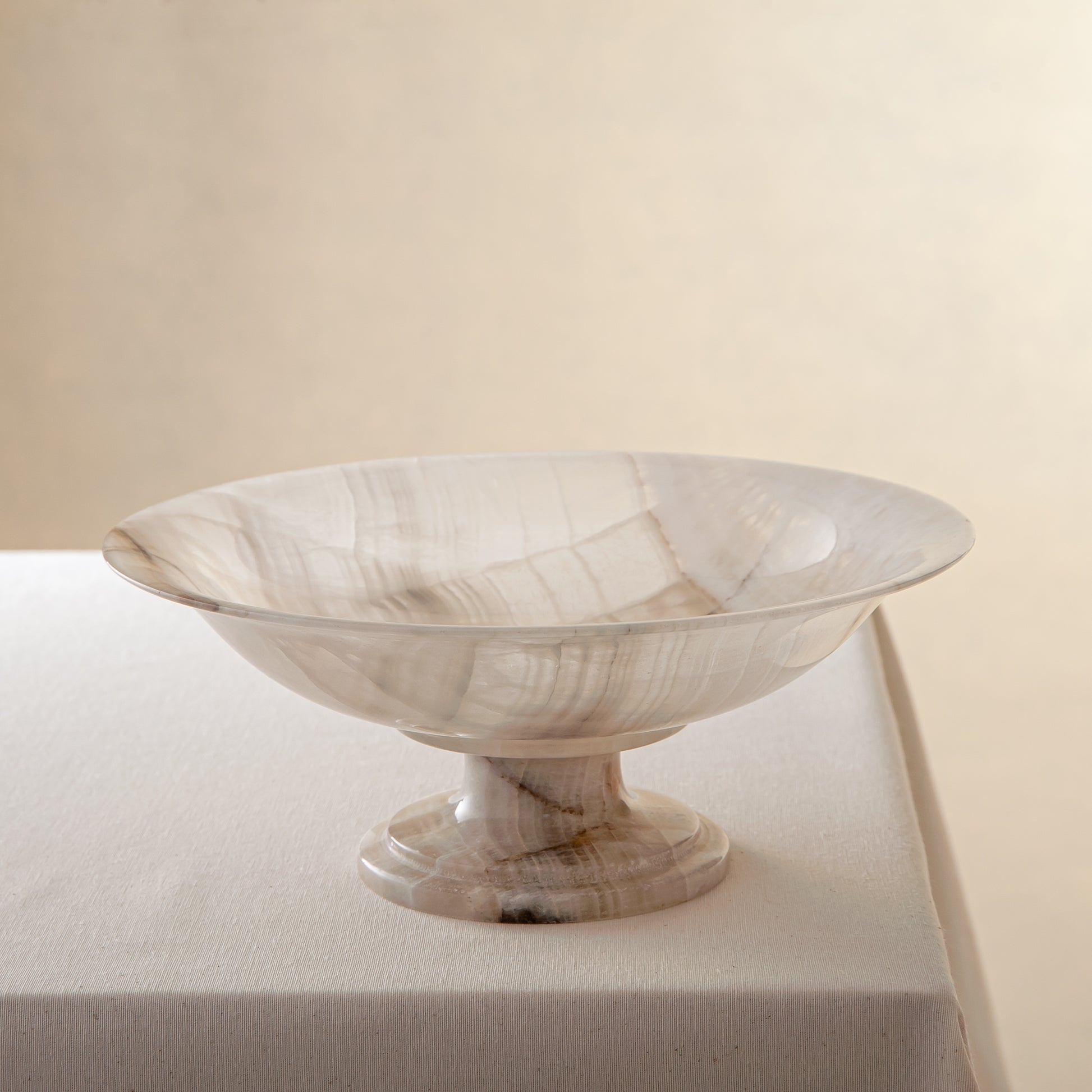 handcrafted onyx bowl with neutral translucency and beige grey veining for luxury decor
